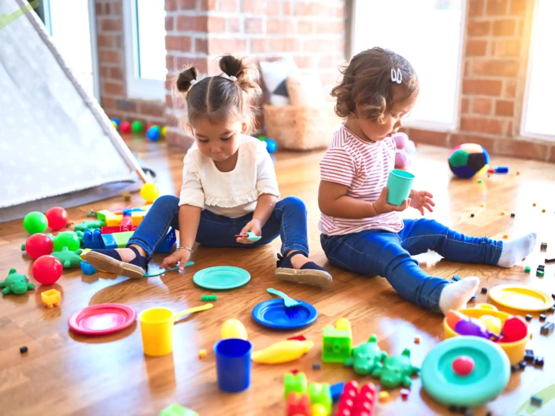 a couple of children playing with toys