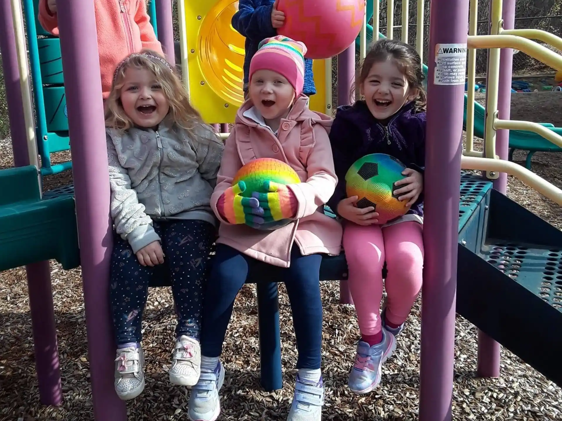 a group of children on a playground ride