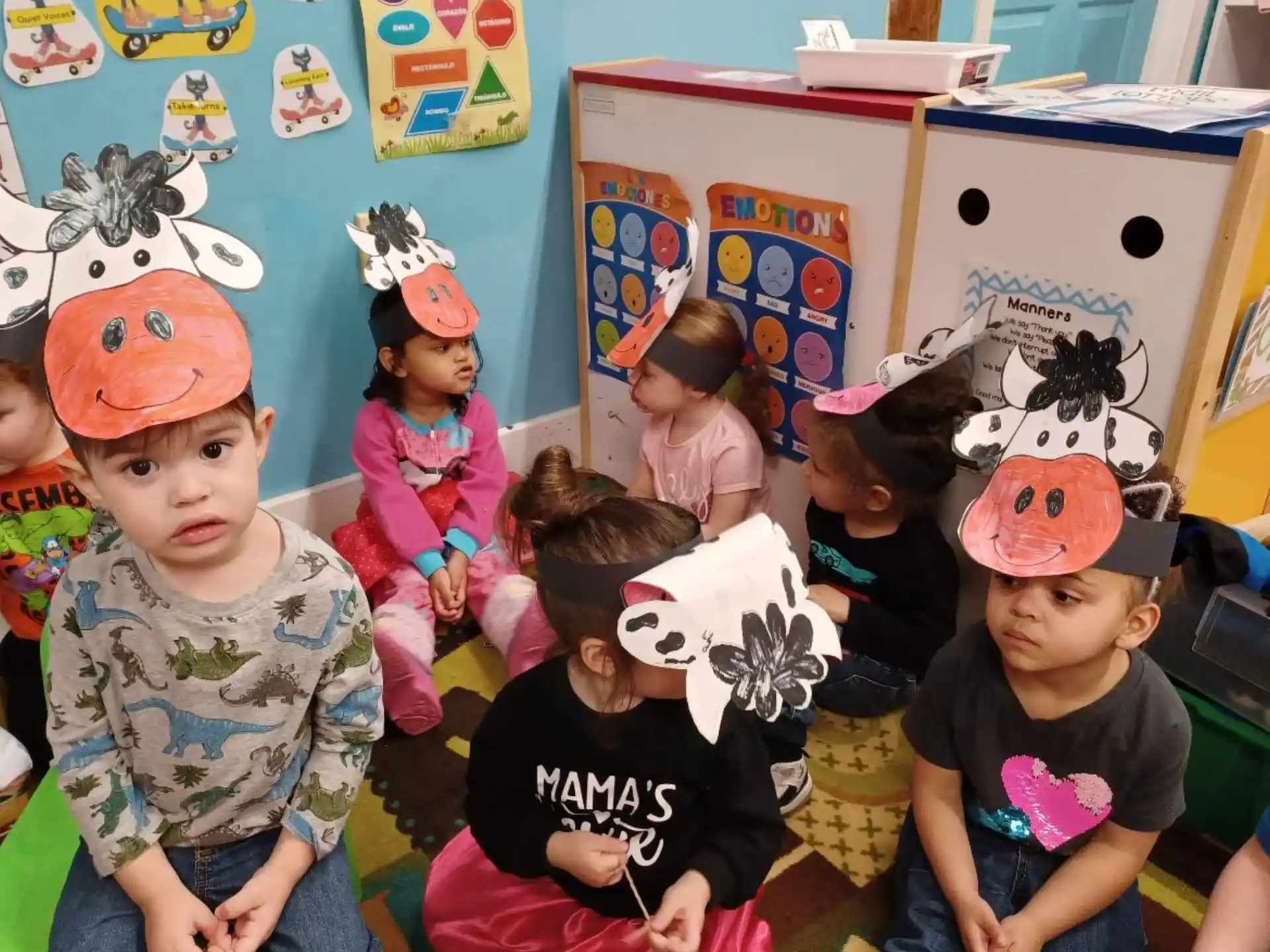 a group of children wearing party hats