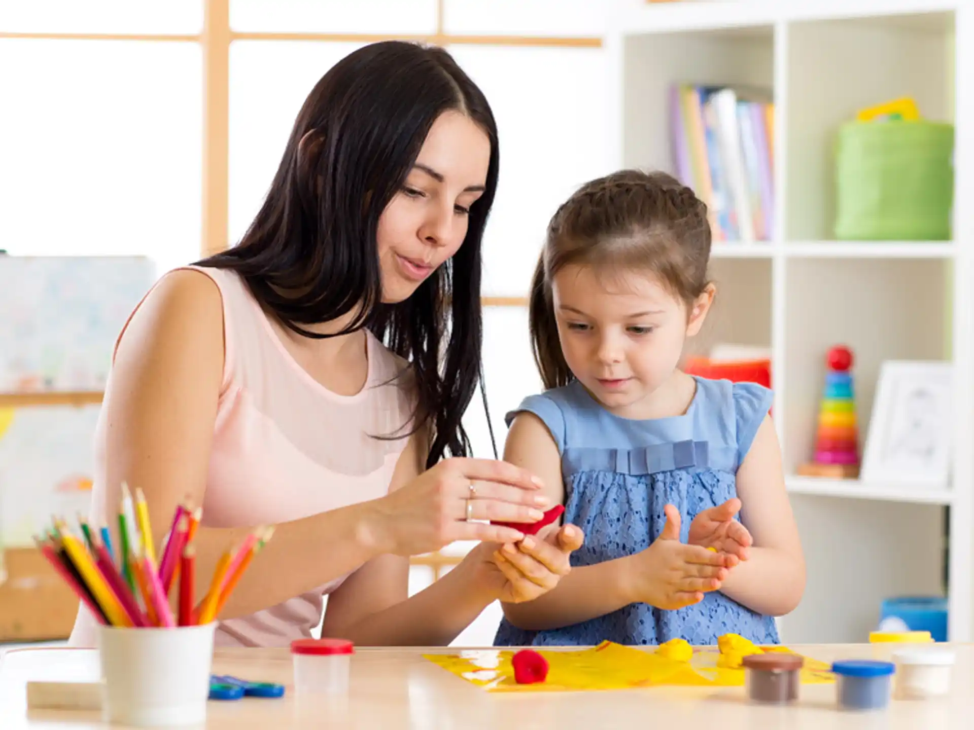a woman and a child painting
