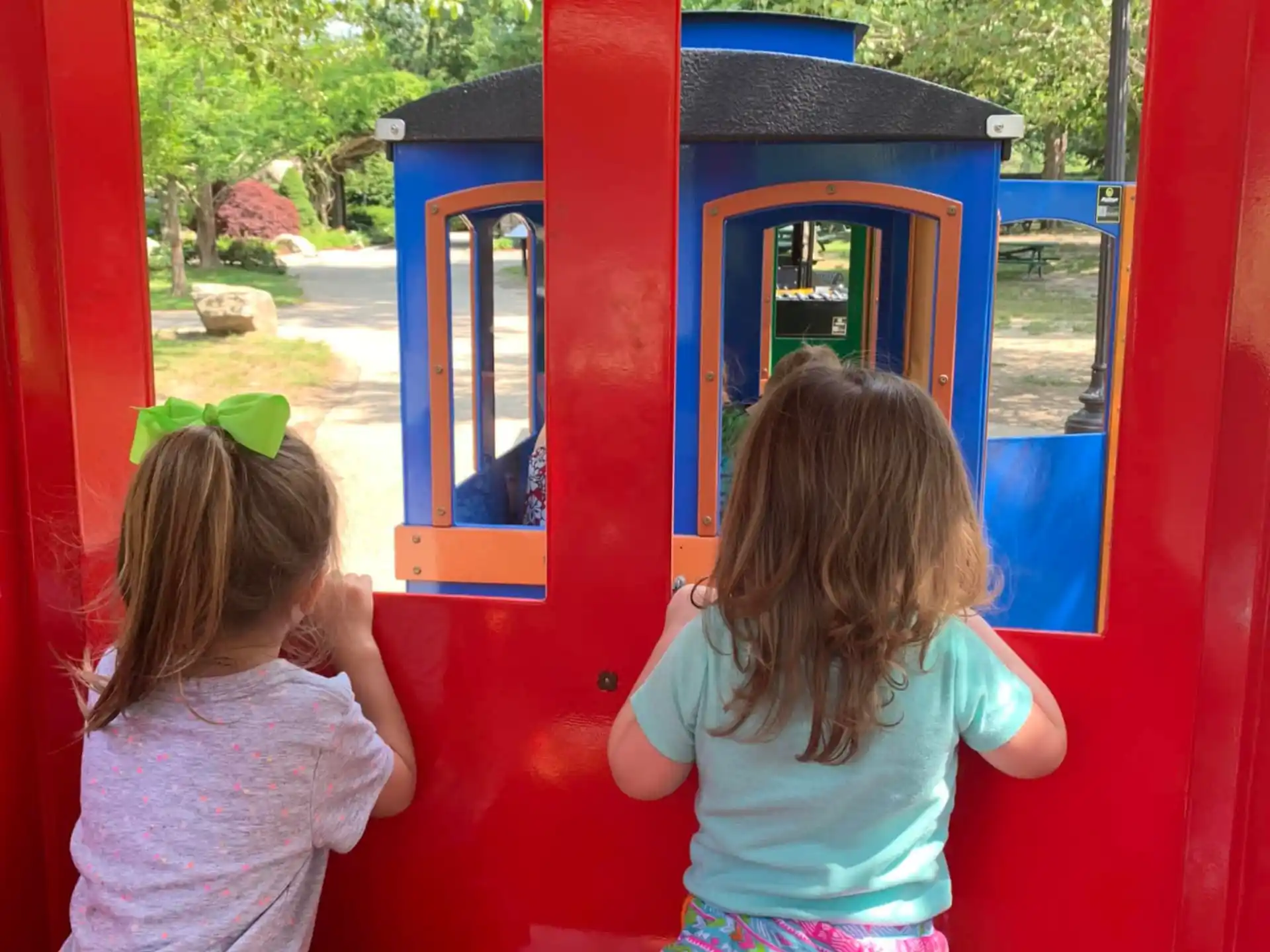 two girls playing in a play structure