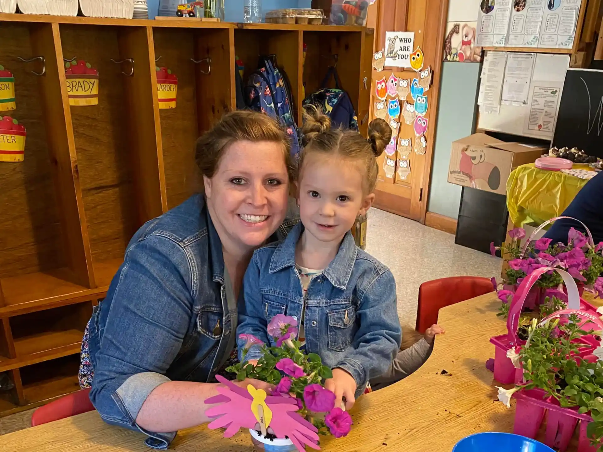 a woman and a child holding flowers