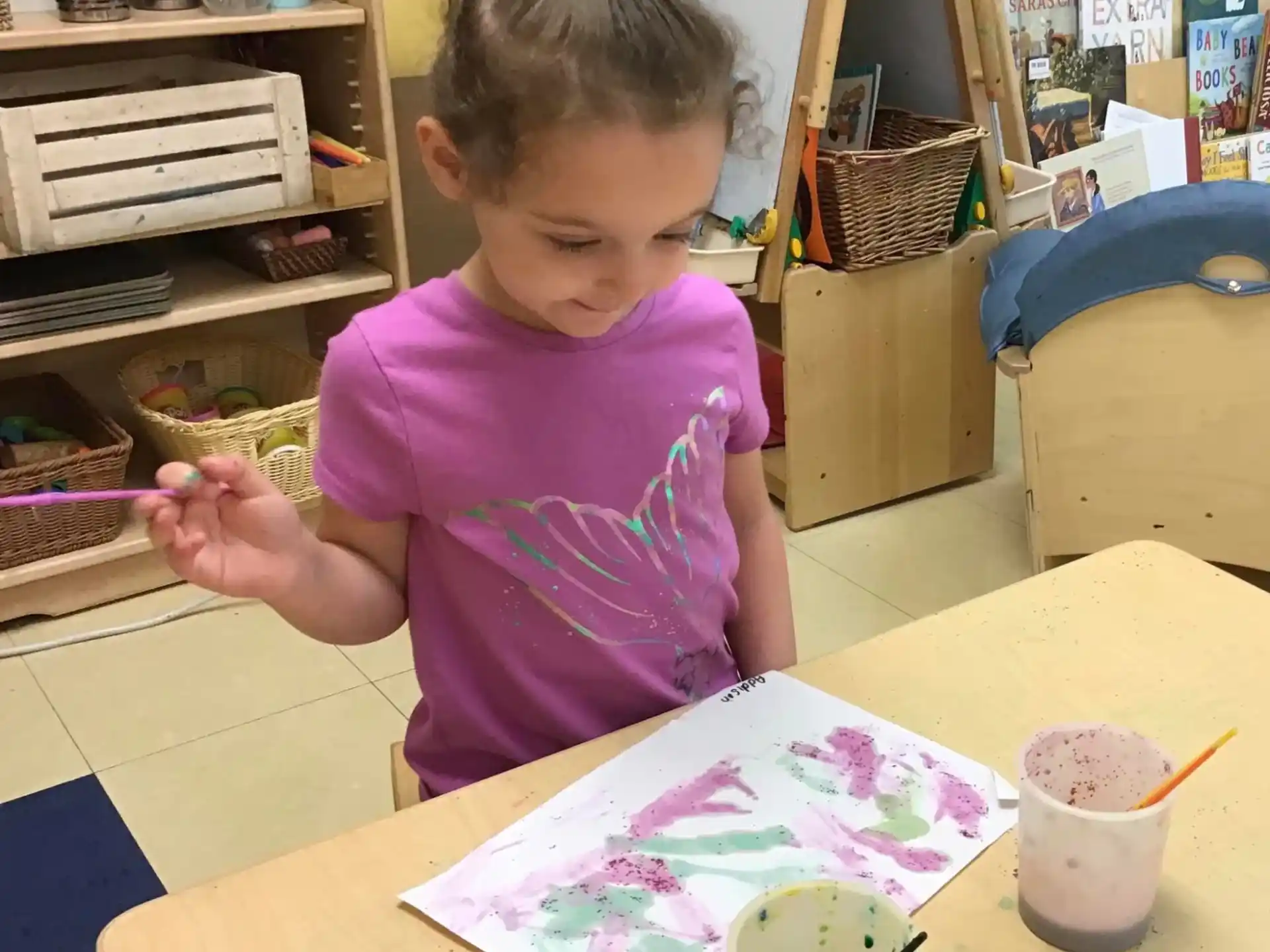 a young girl painting