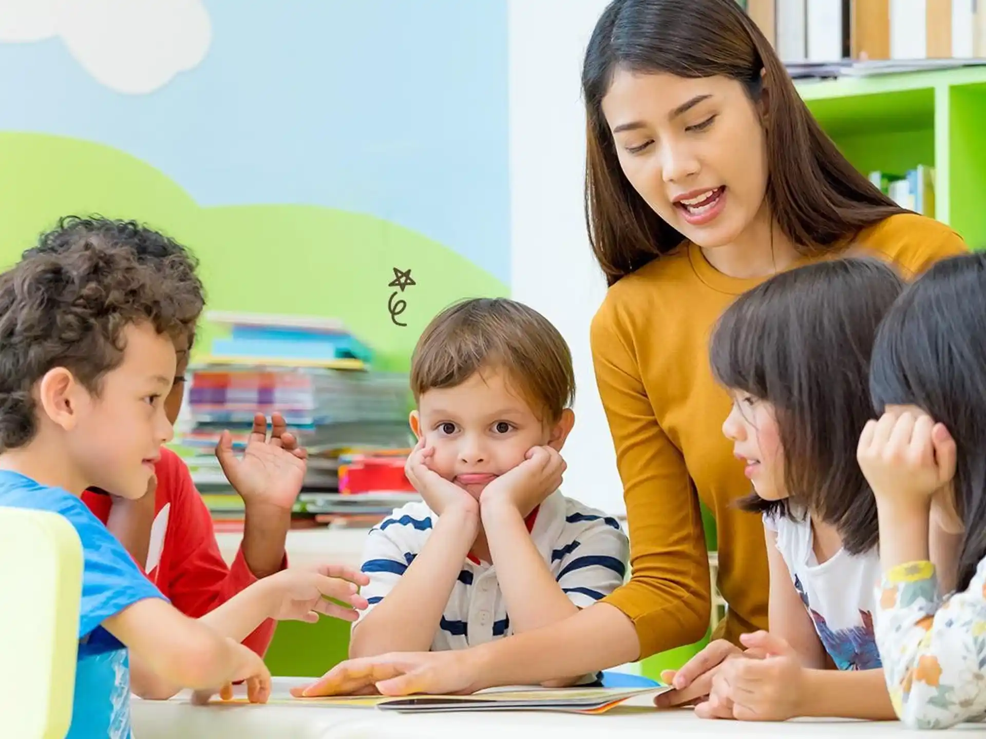 a person and children sitting at a table