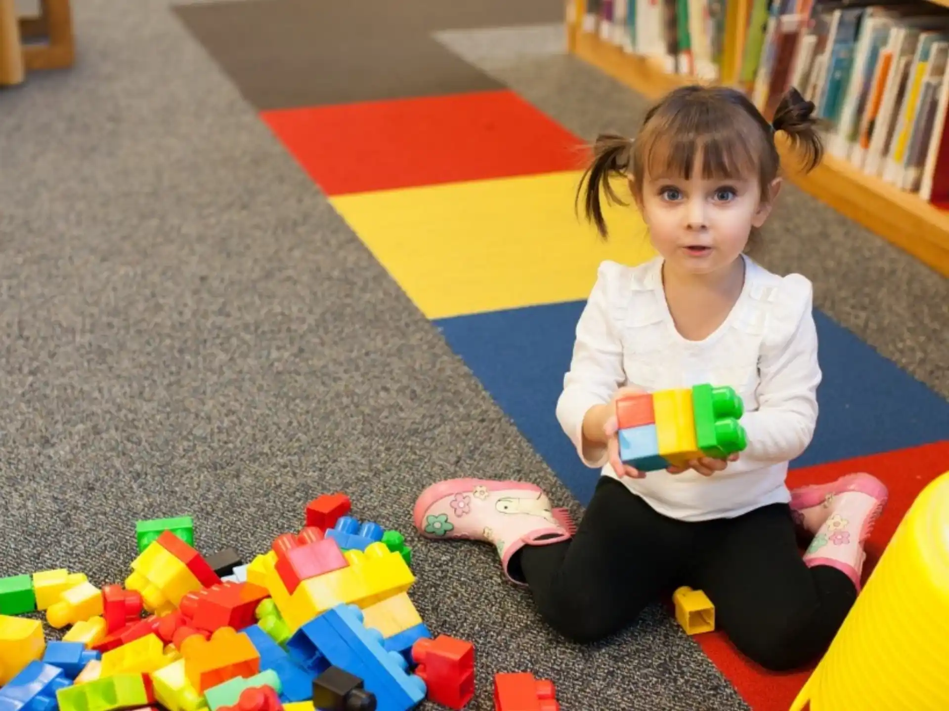 a girl sitting on the floor