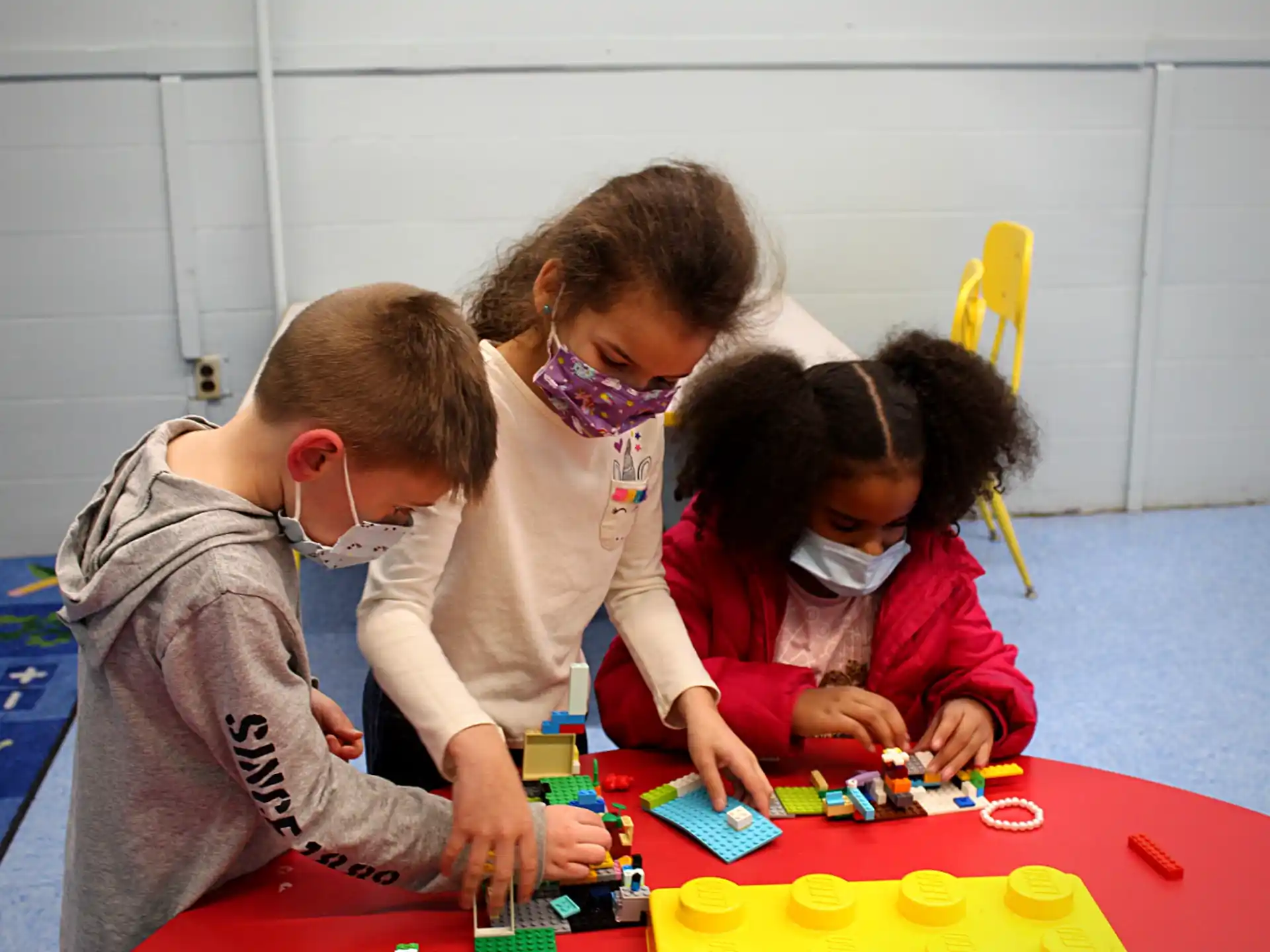 a group of people playing with toys