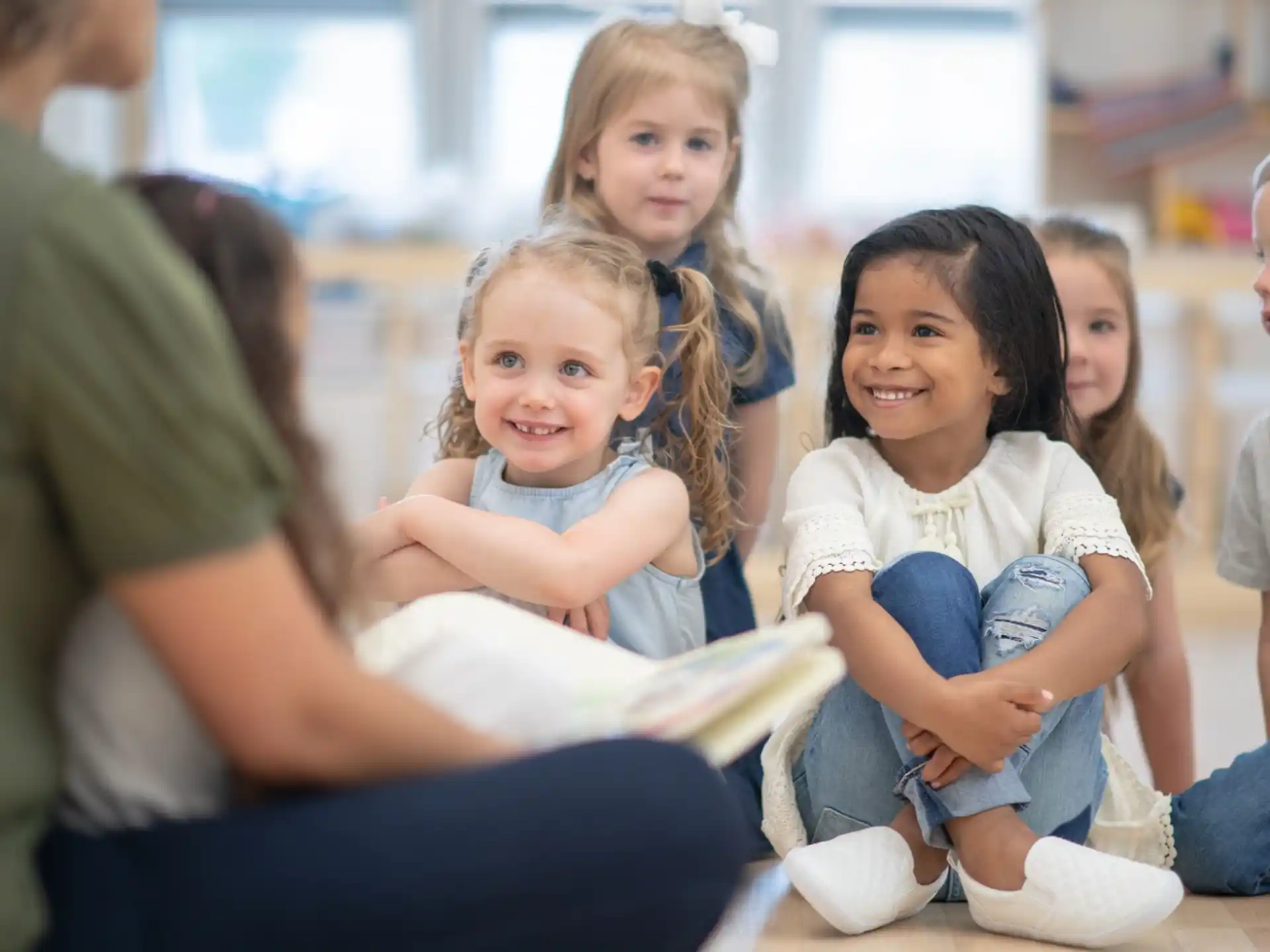 a group of children sitting on the floor