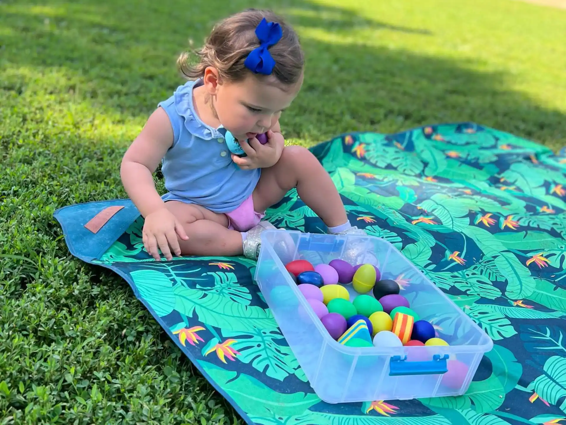 a girl playing with a ball