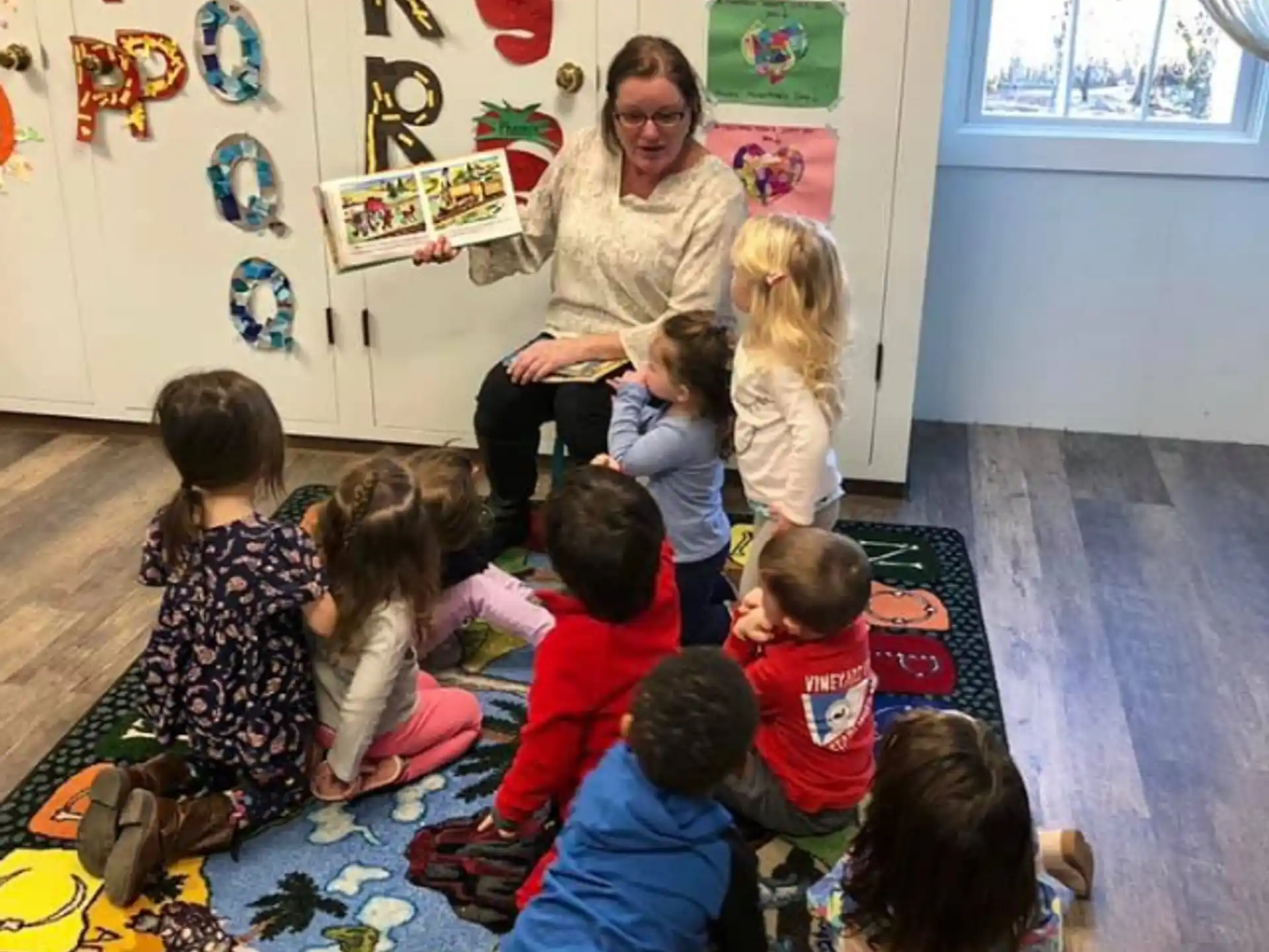 a person teaching children in a classroom