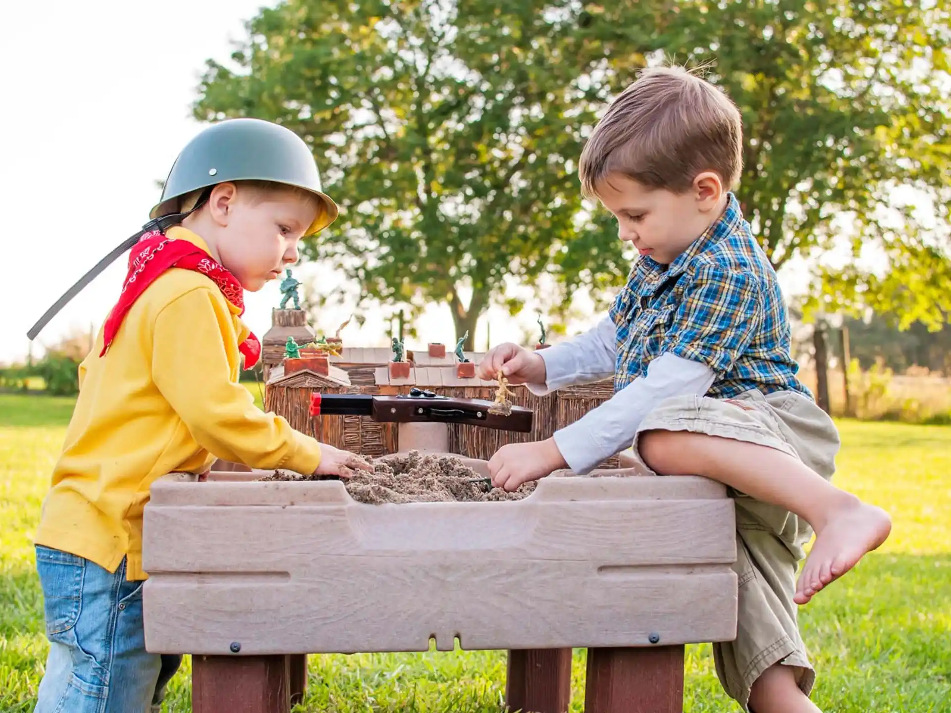 two boys playing with a toy