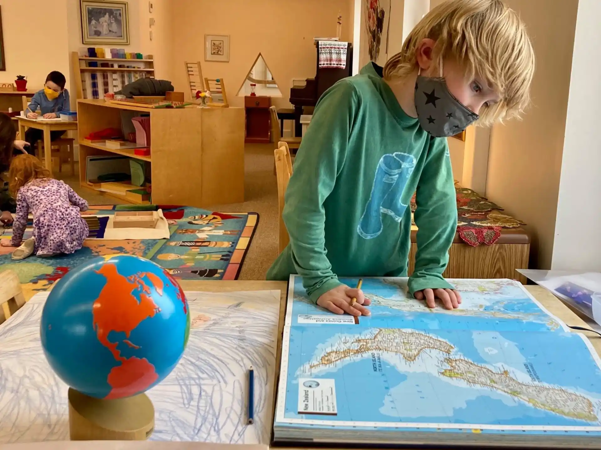 a child painting on a table