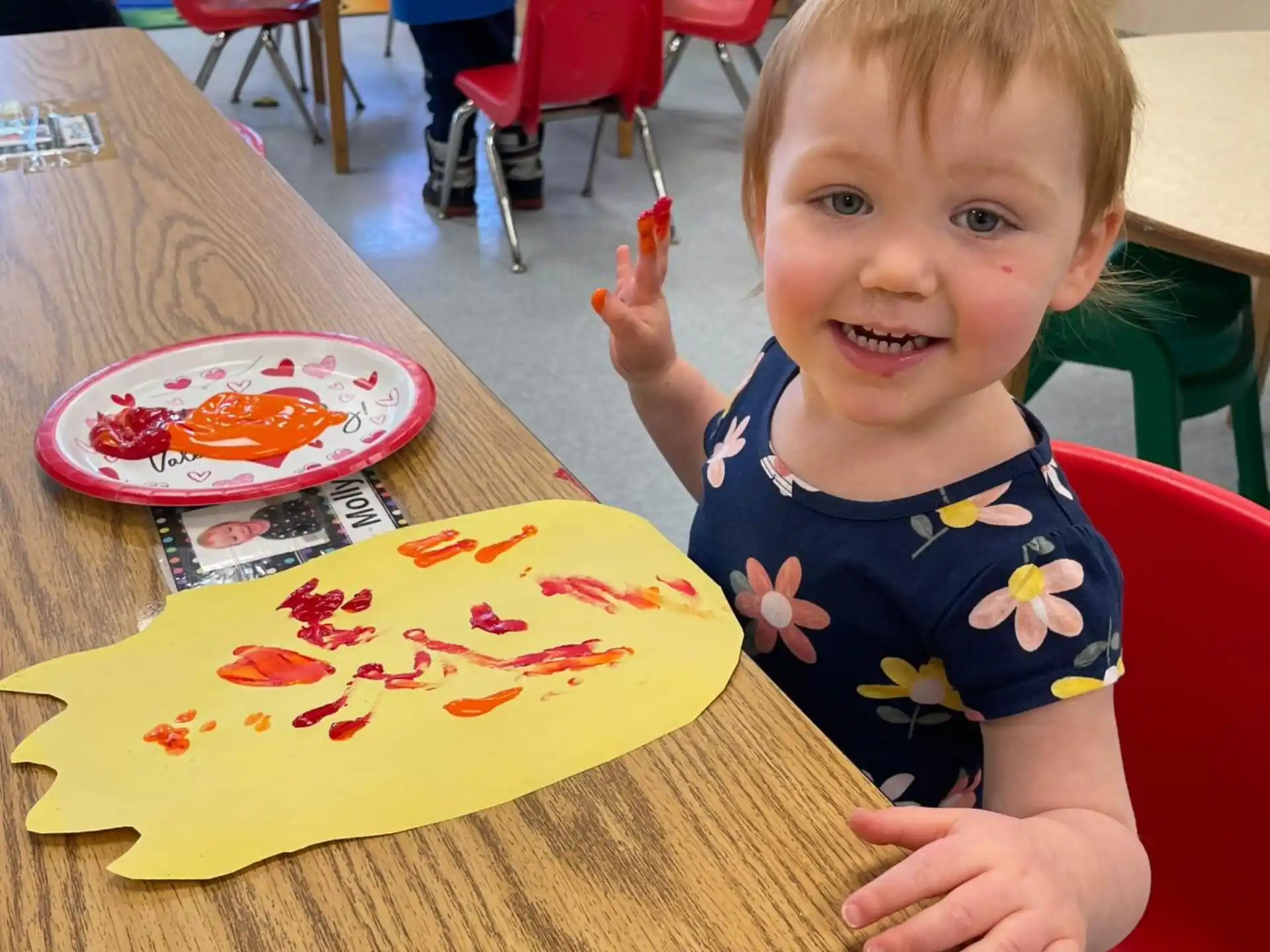 a child sitting at a table