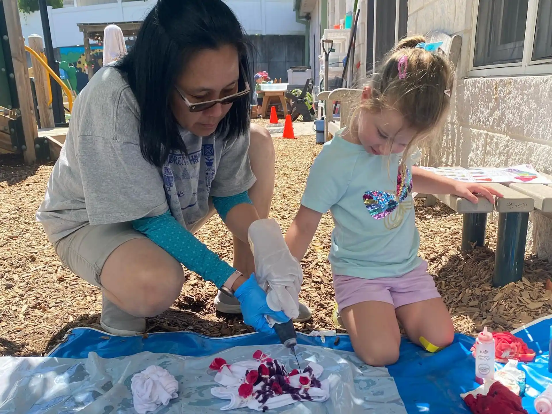 a woman and a child painting