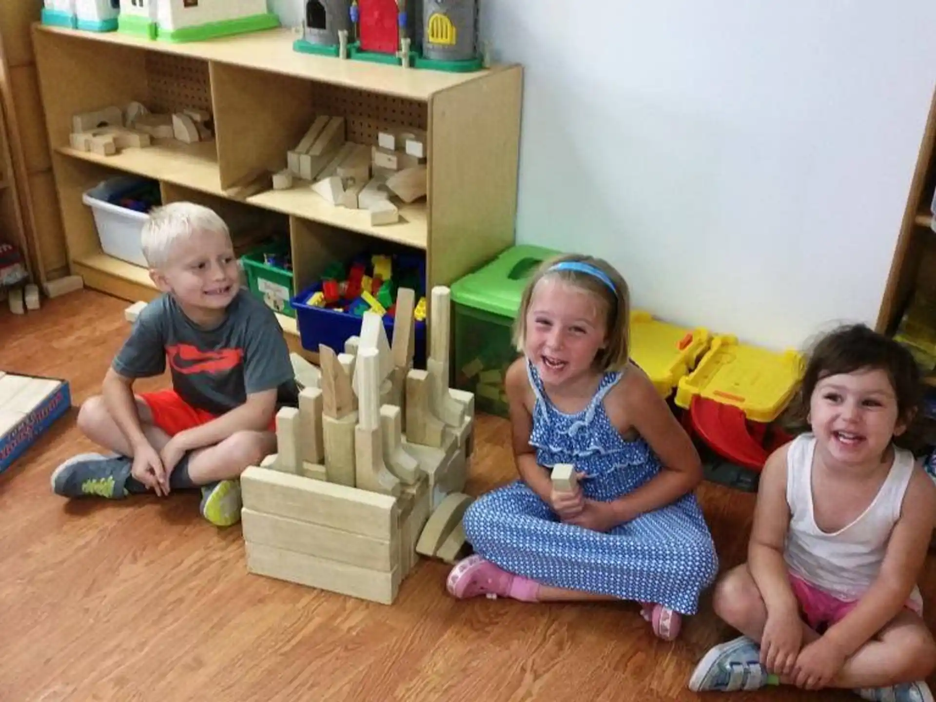 a group of children sitting on the floor