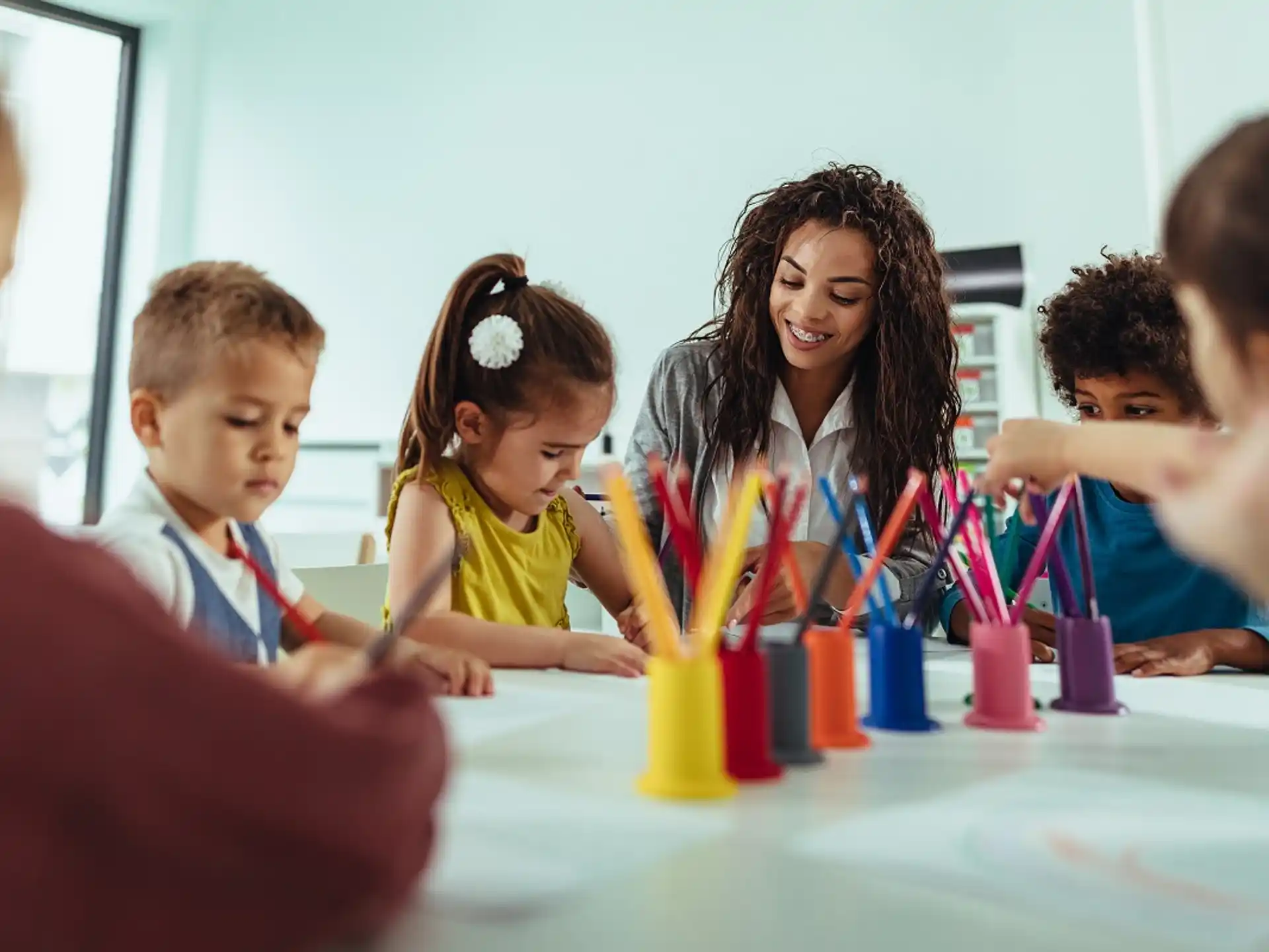 a group of children sitting at a table