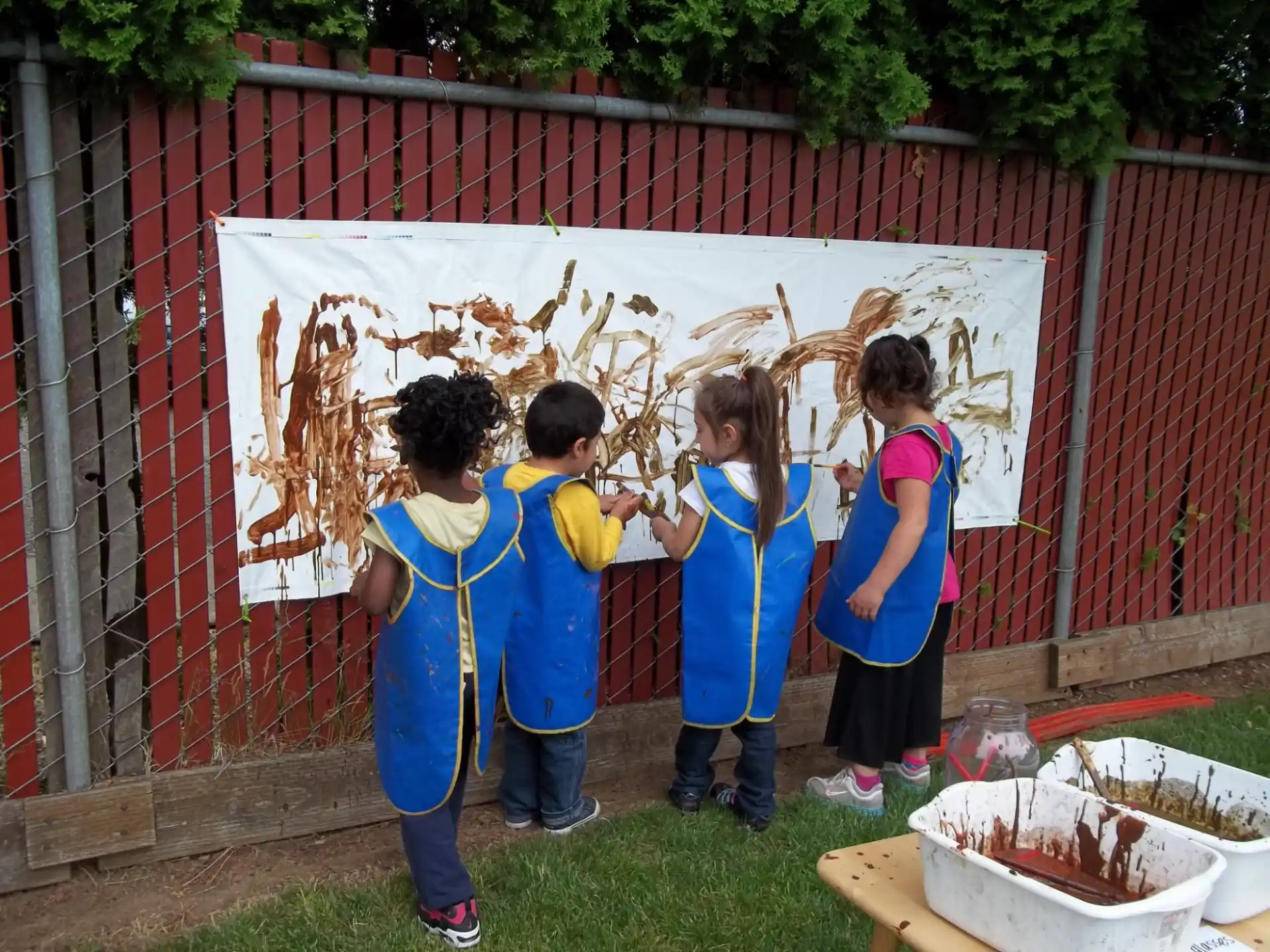 a group of children painting