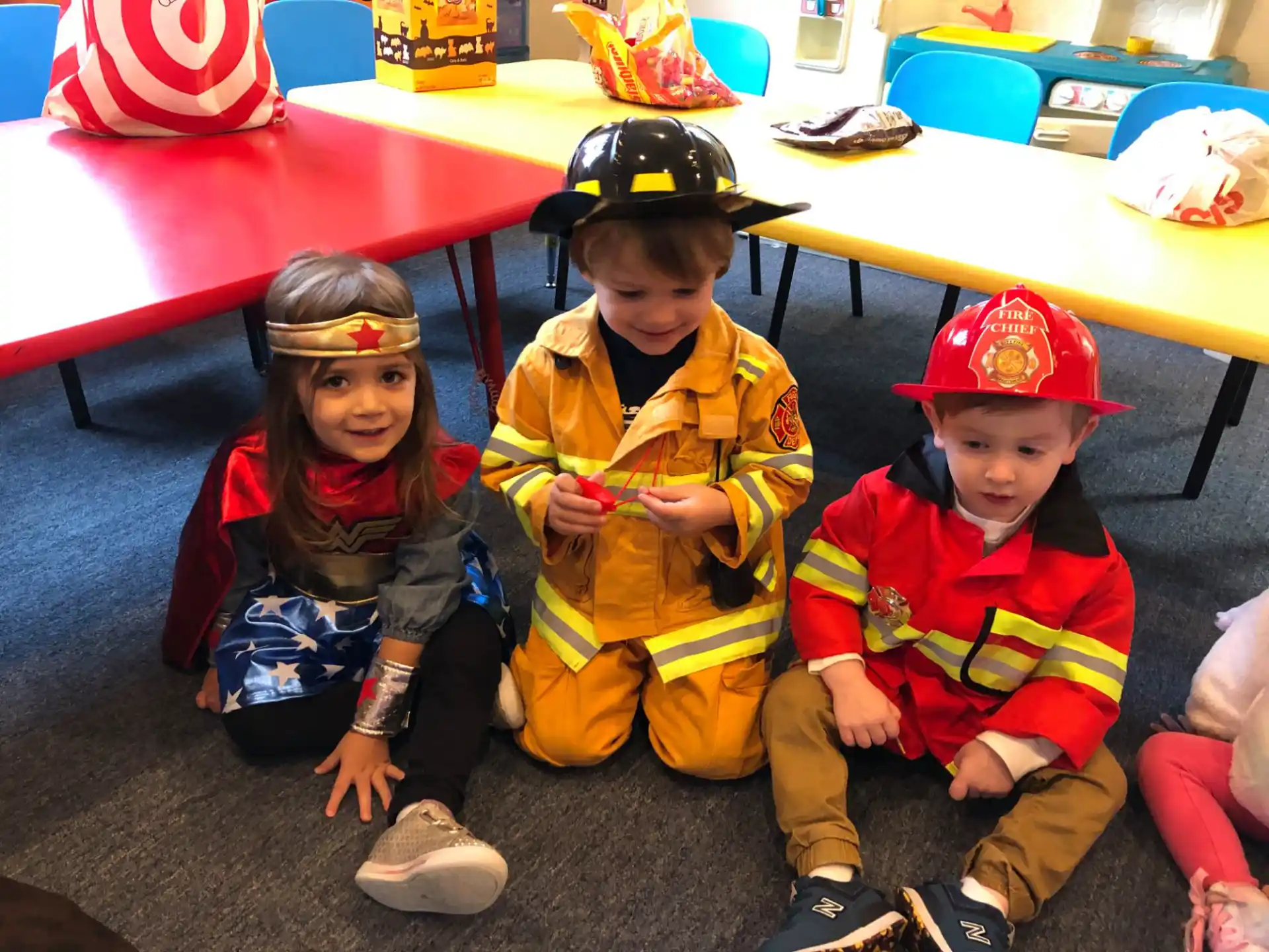 a group of children sitting on the floor