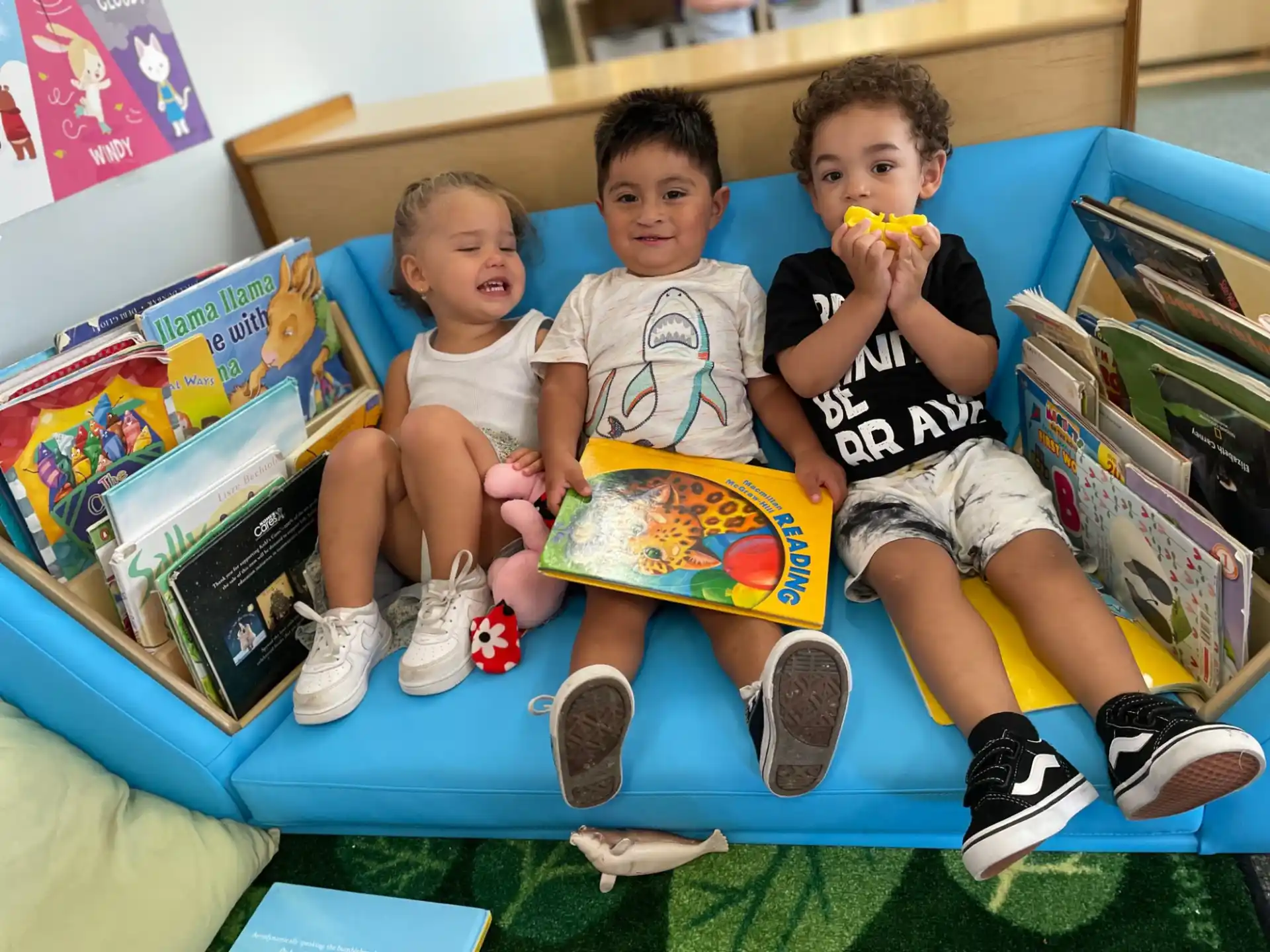 a group of kids sitting on a couch