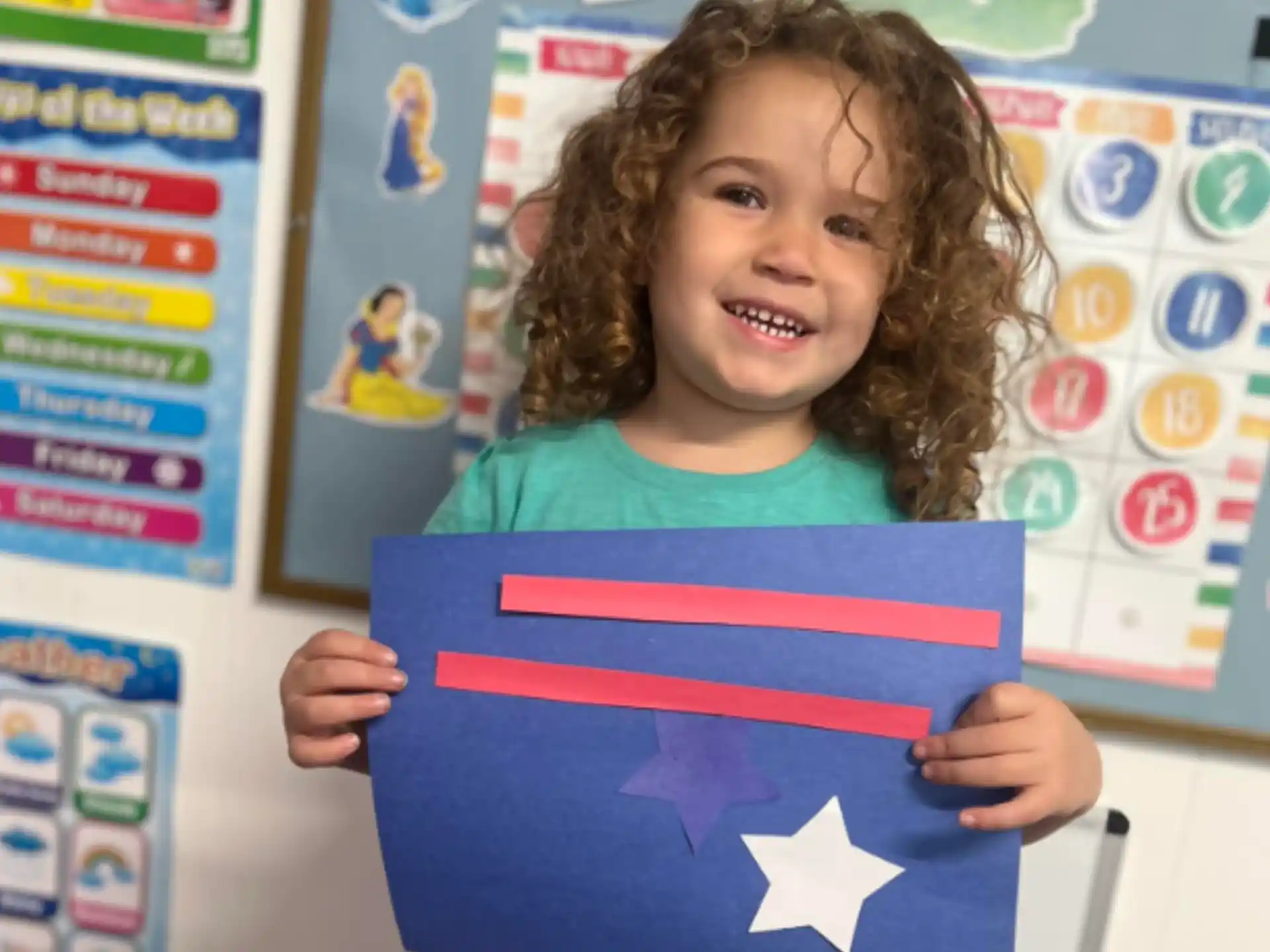 a child holding a flag