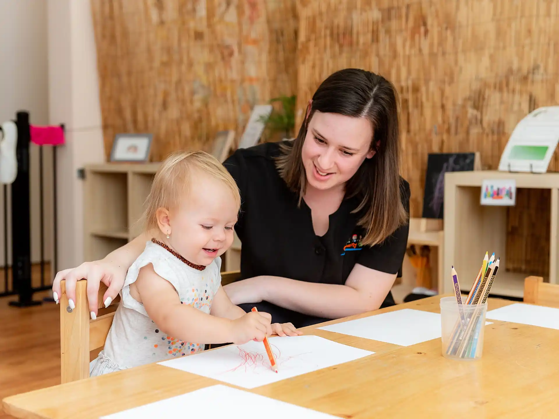 a person and a child sitting at a table