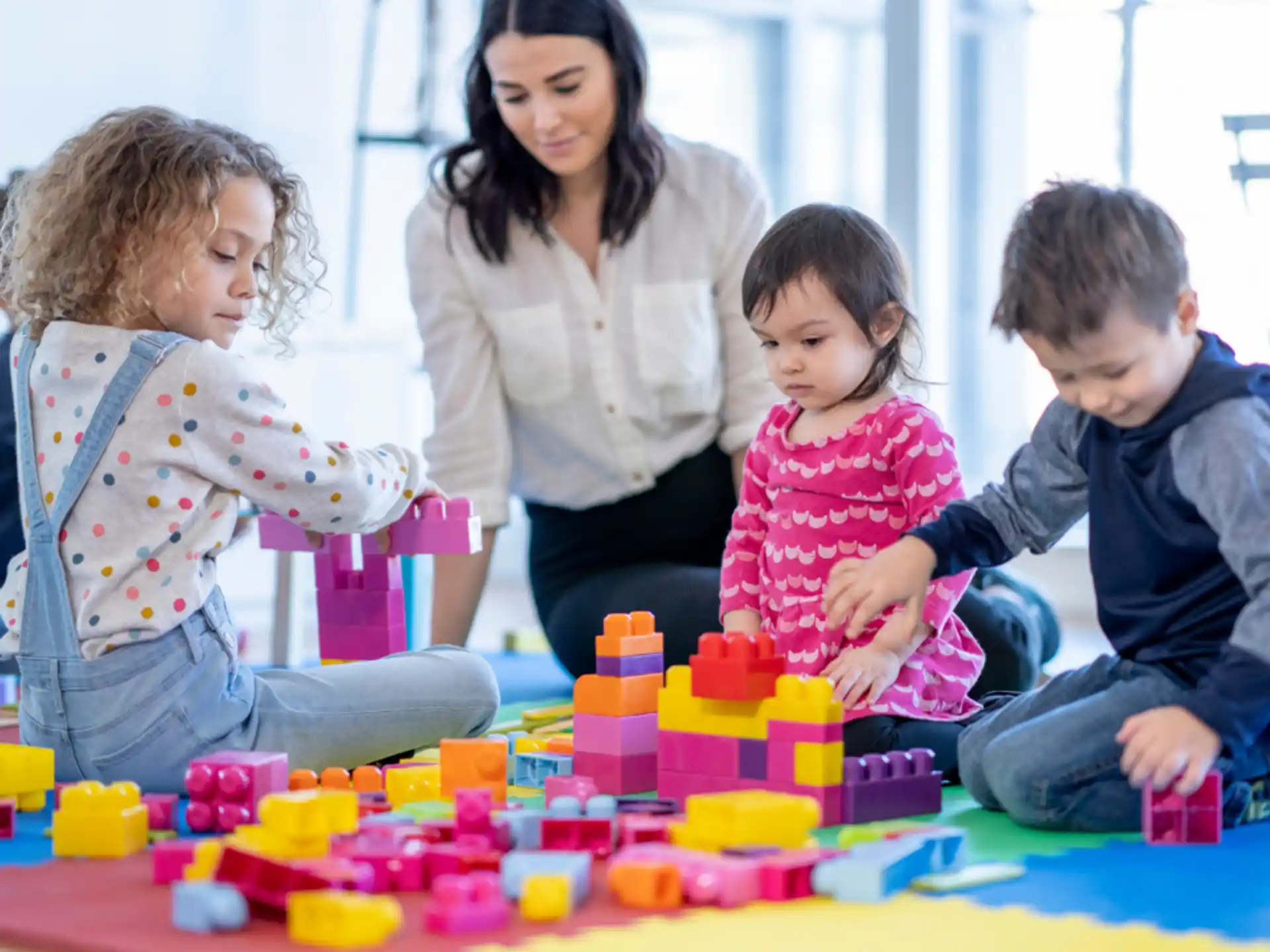 a group of people playing with toys