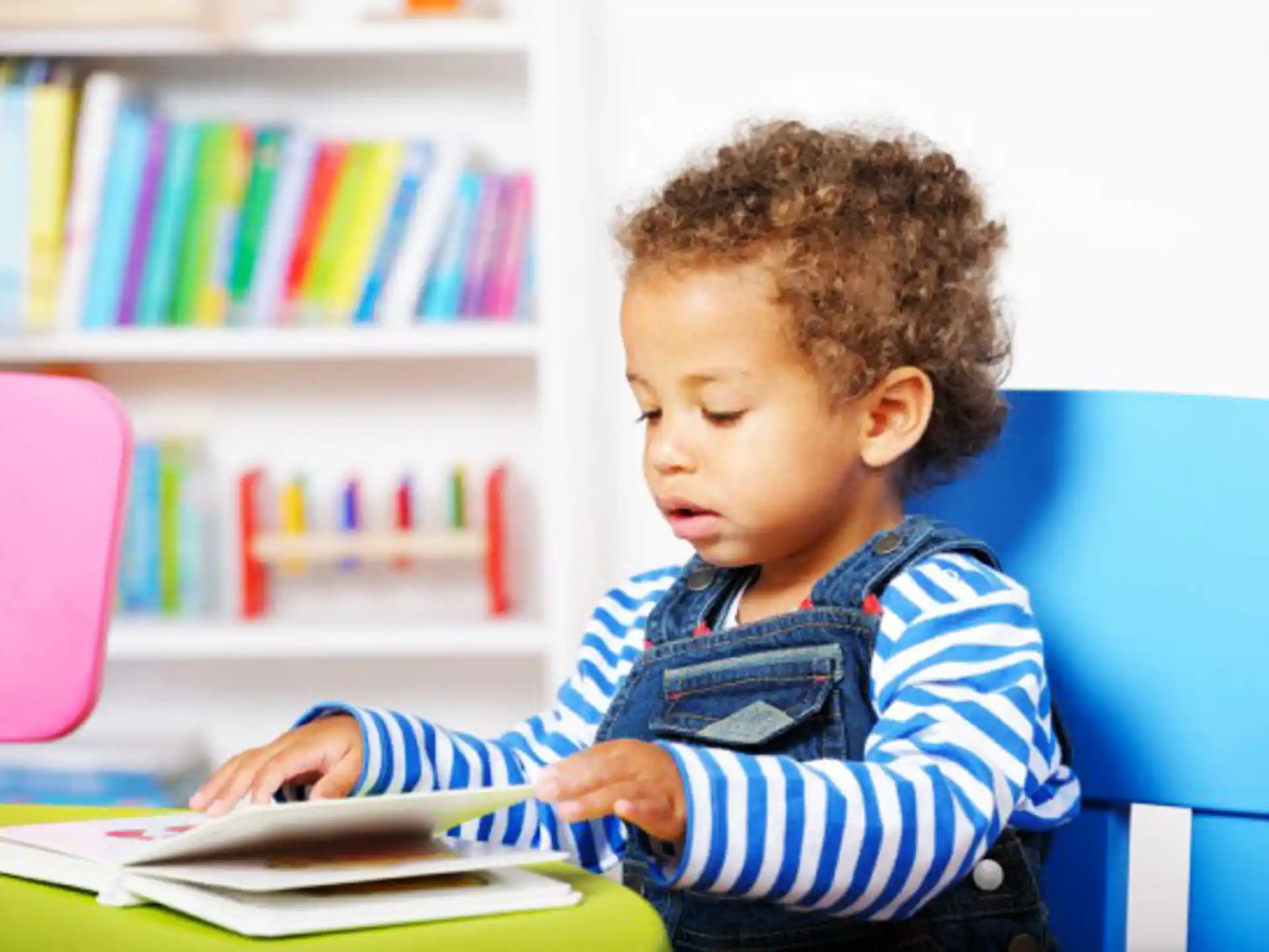 a young boy reading a book