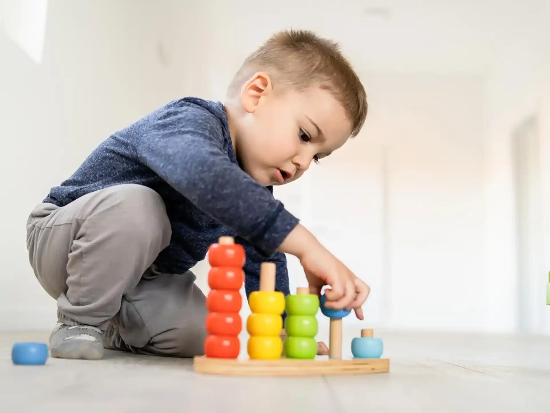 a baby playing with toys