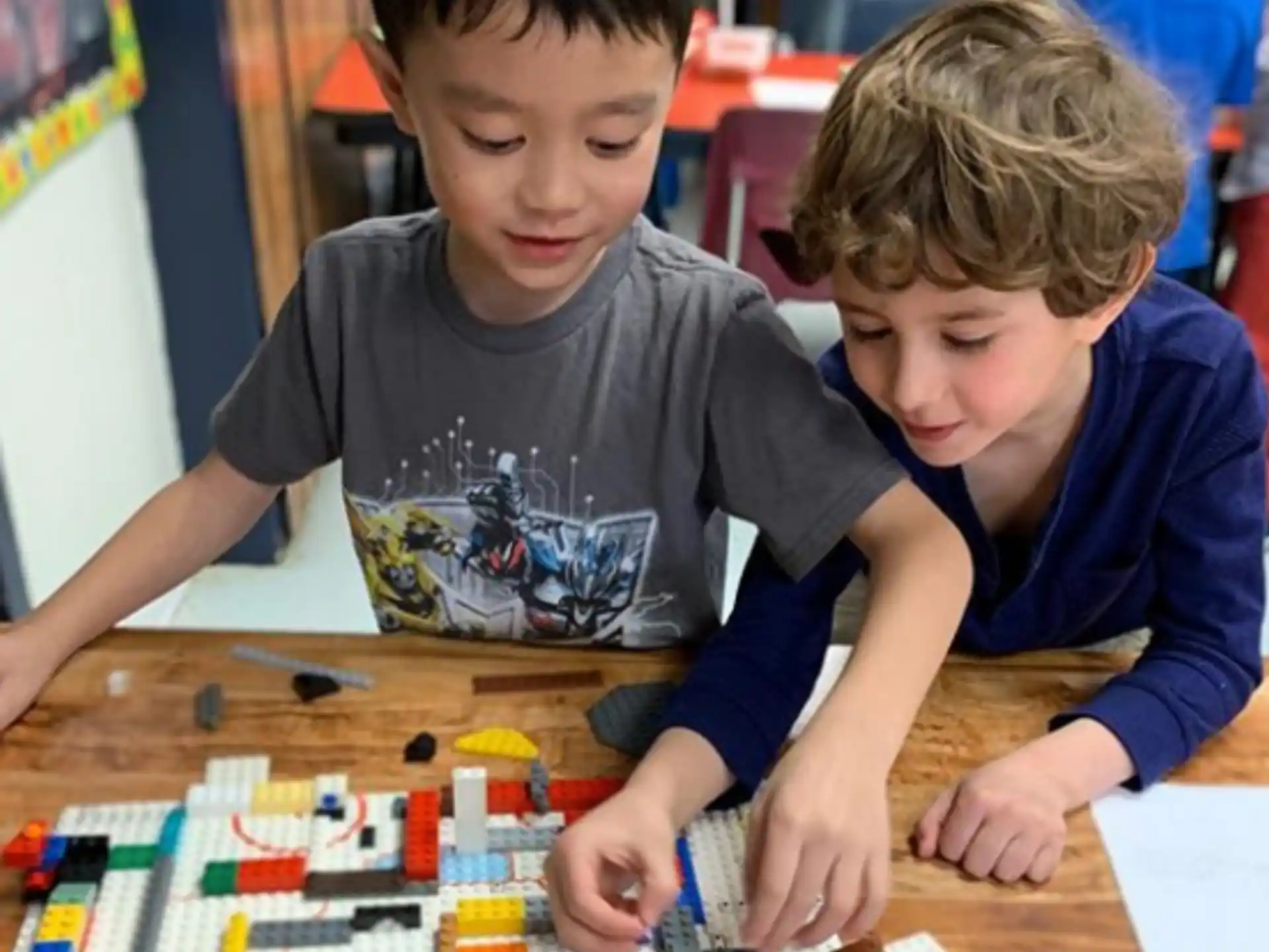 a couple of boys playing with toys