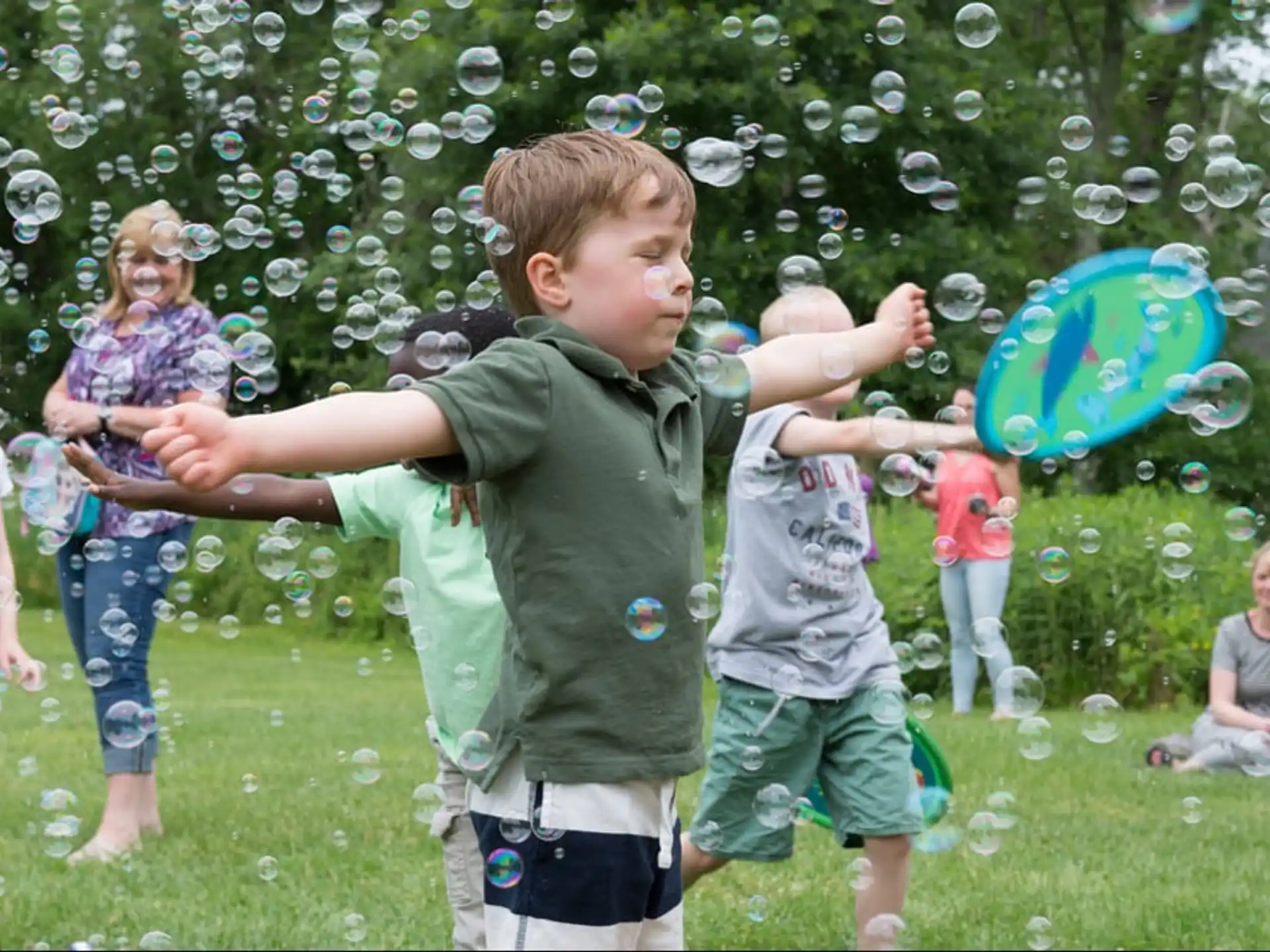 a group of people playing with a frisbee