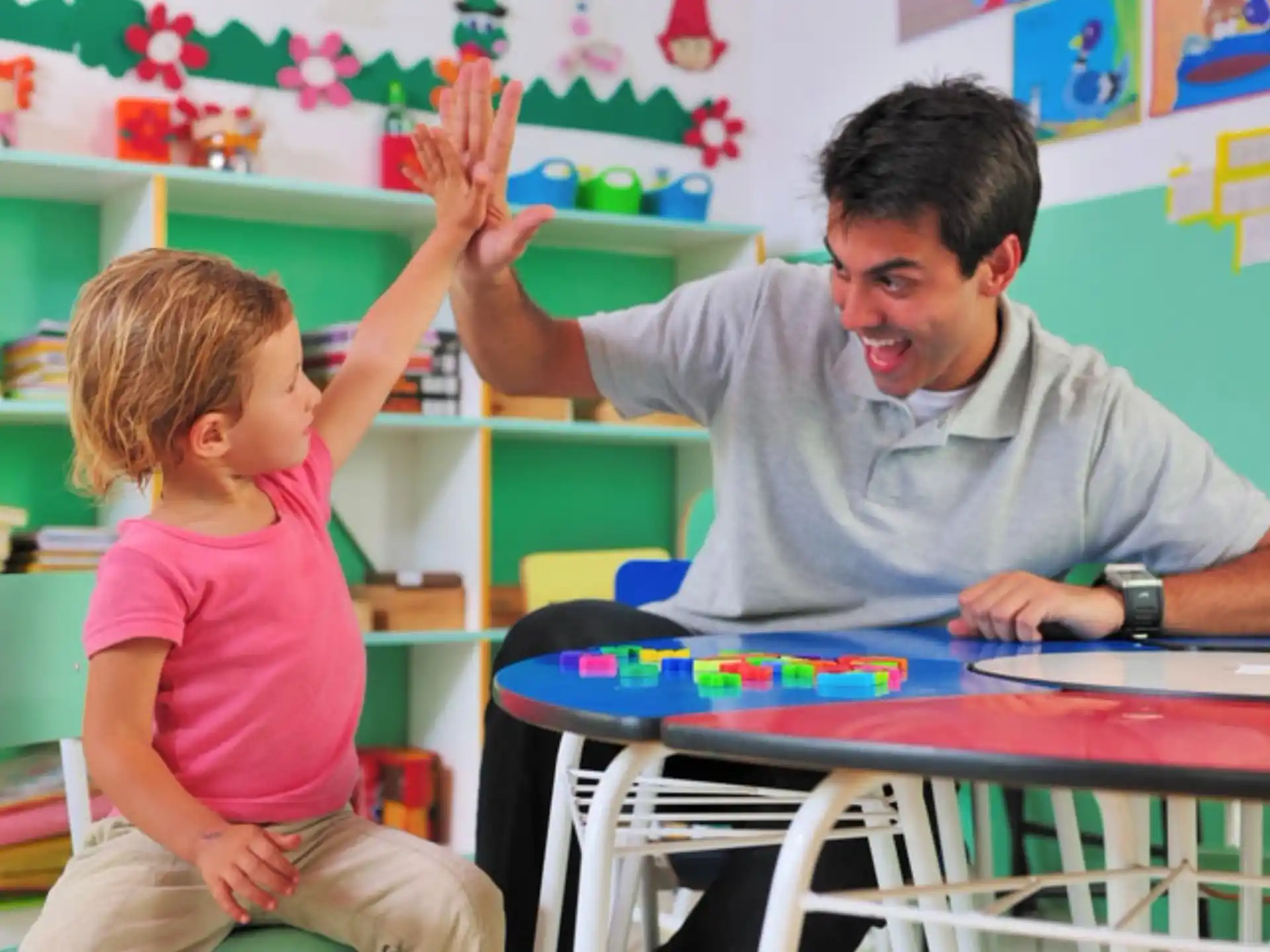 a person and a child in a classroom