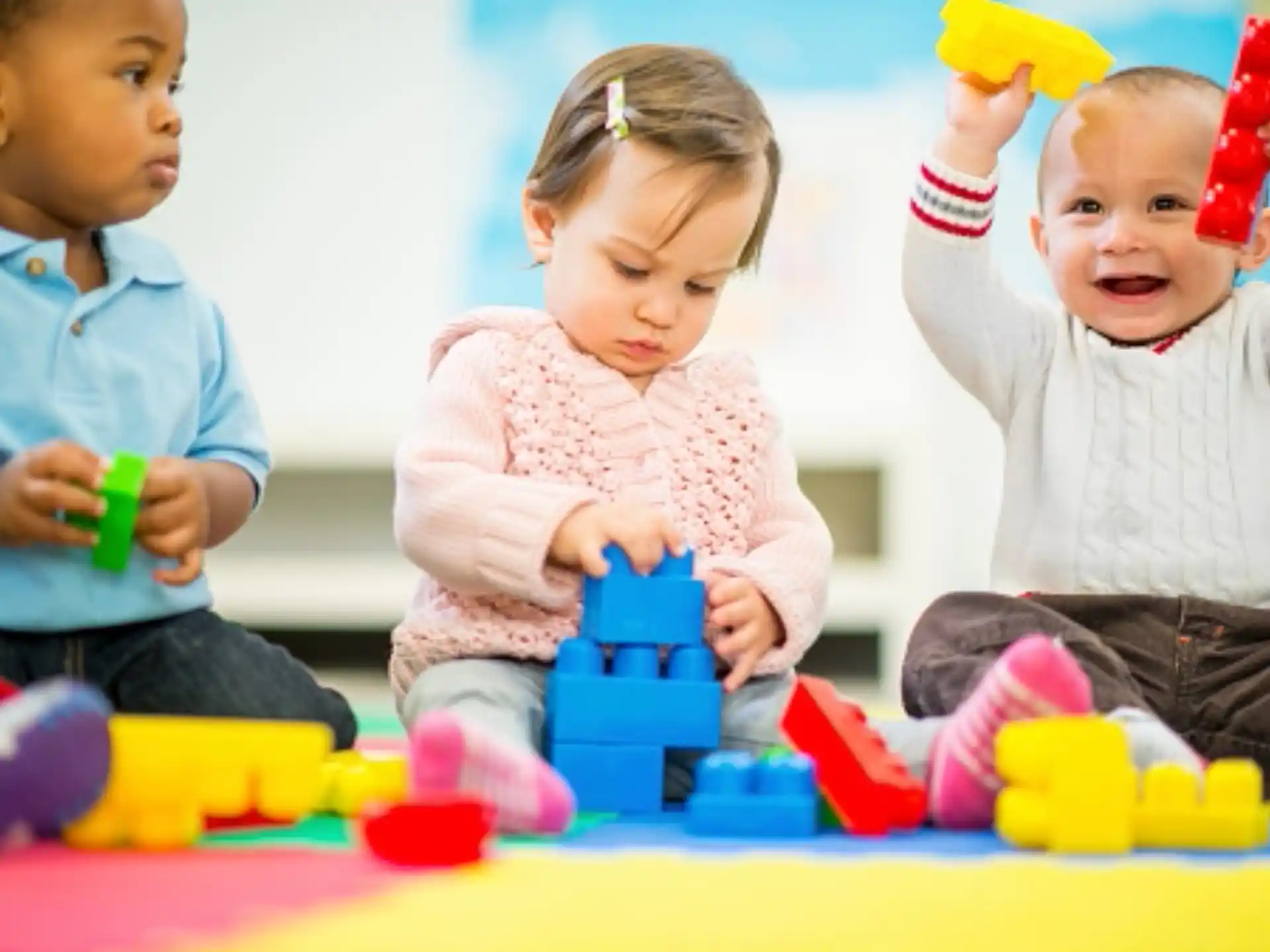a group of children playing with toys
