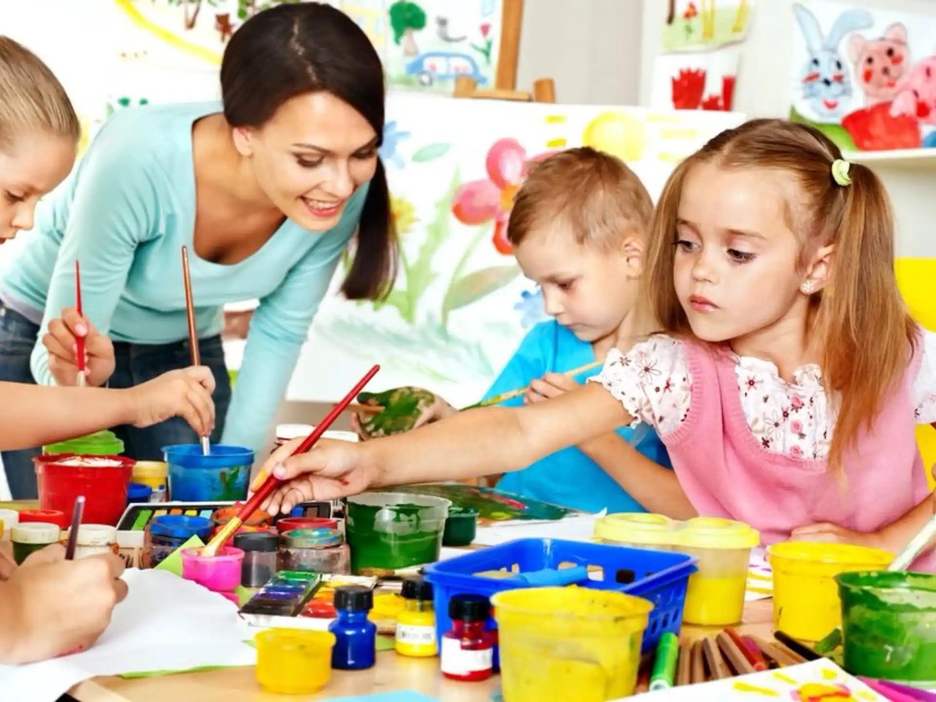 a person and children painting