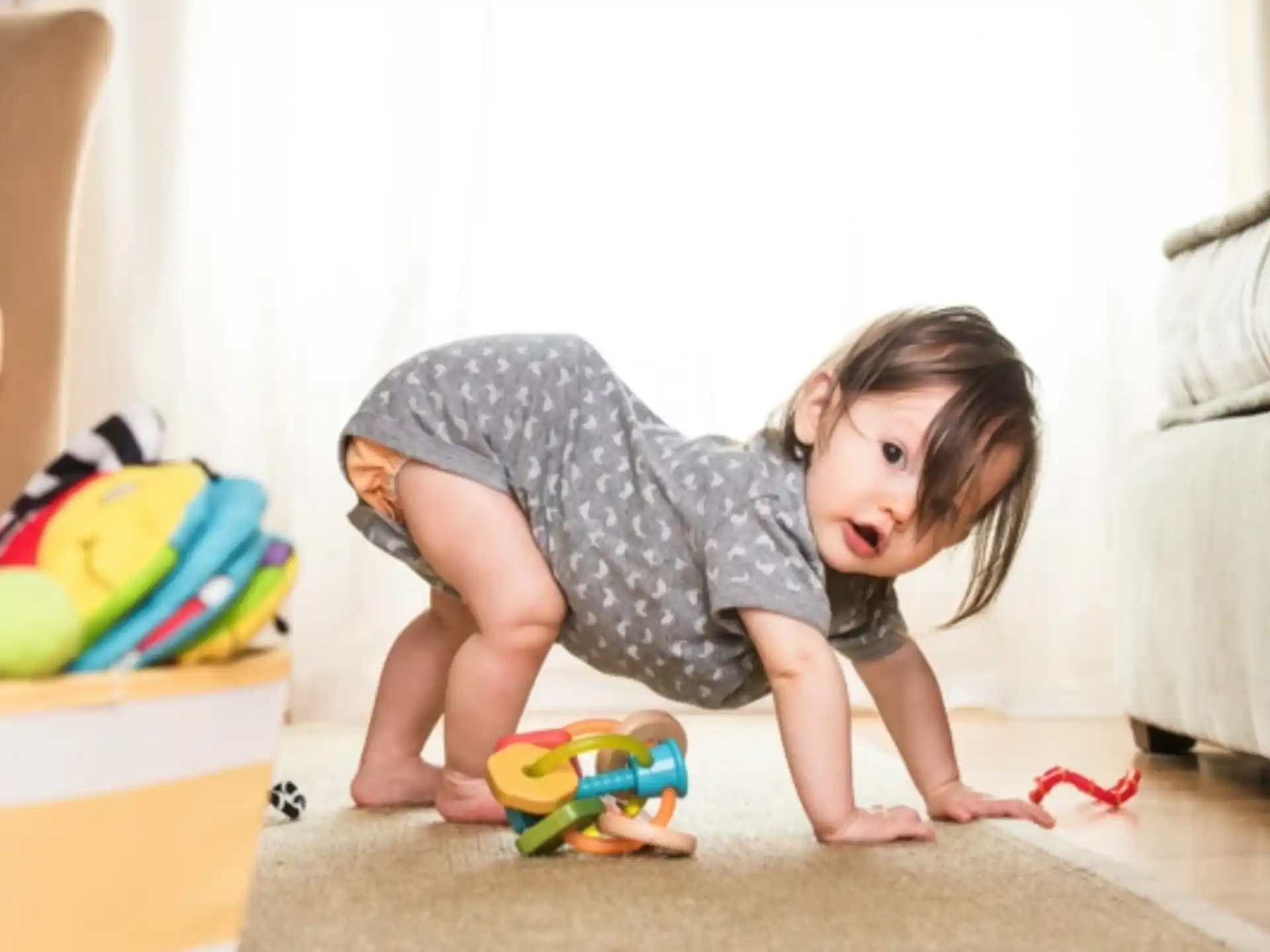 a baby crawling on the floor