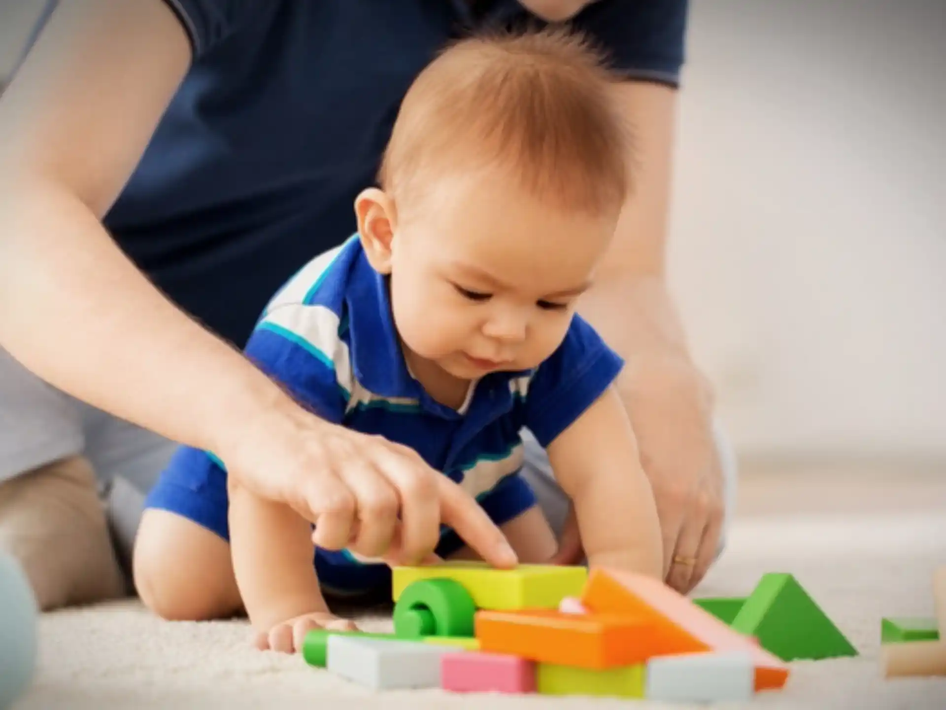 a baby playing with toys