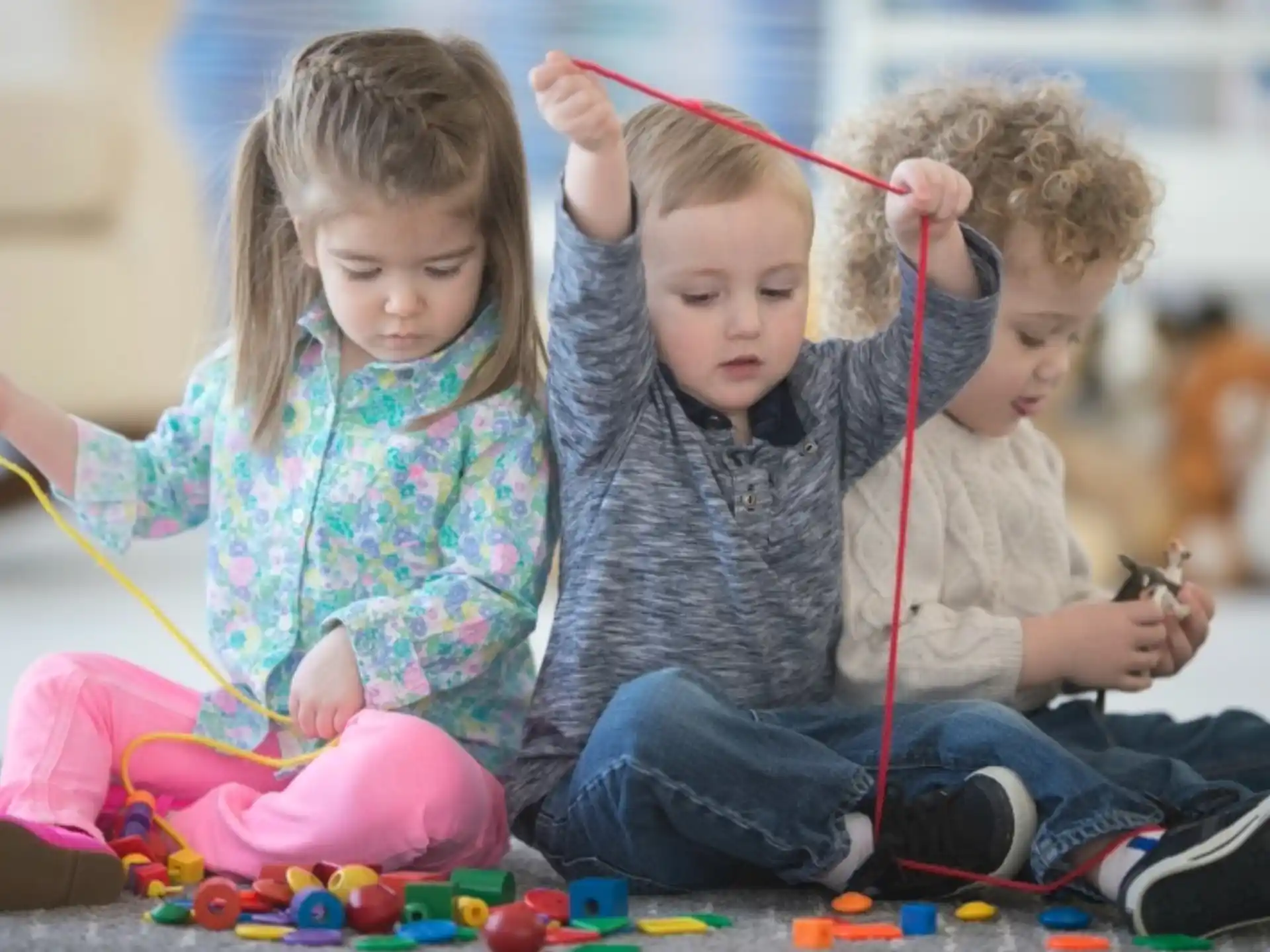 a couple of children playing with toys