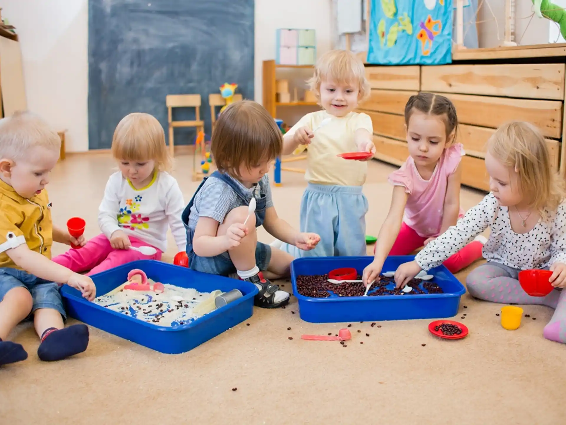 a group of children playing with toys