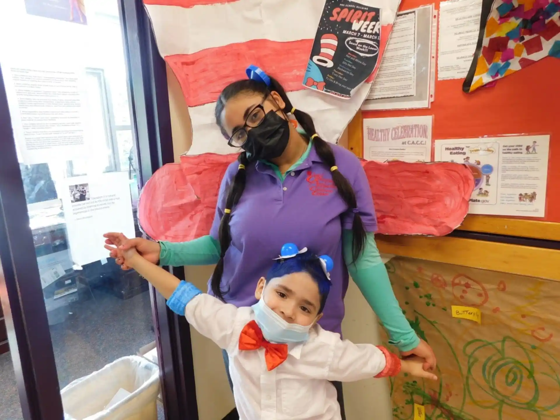 a person and a child in a classroom