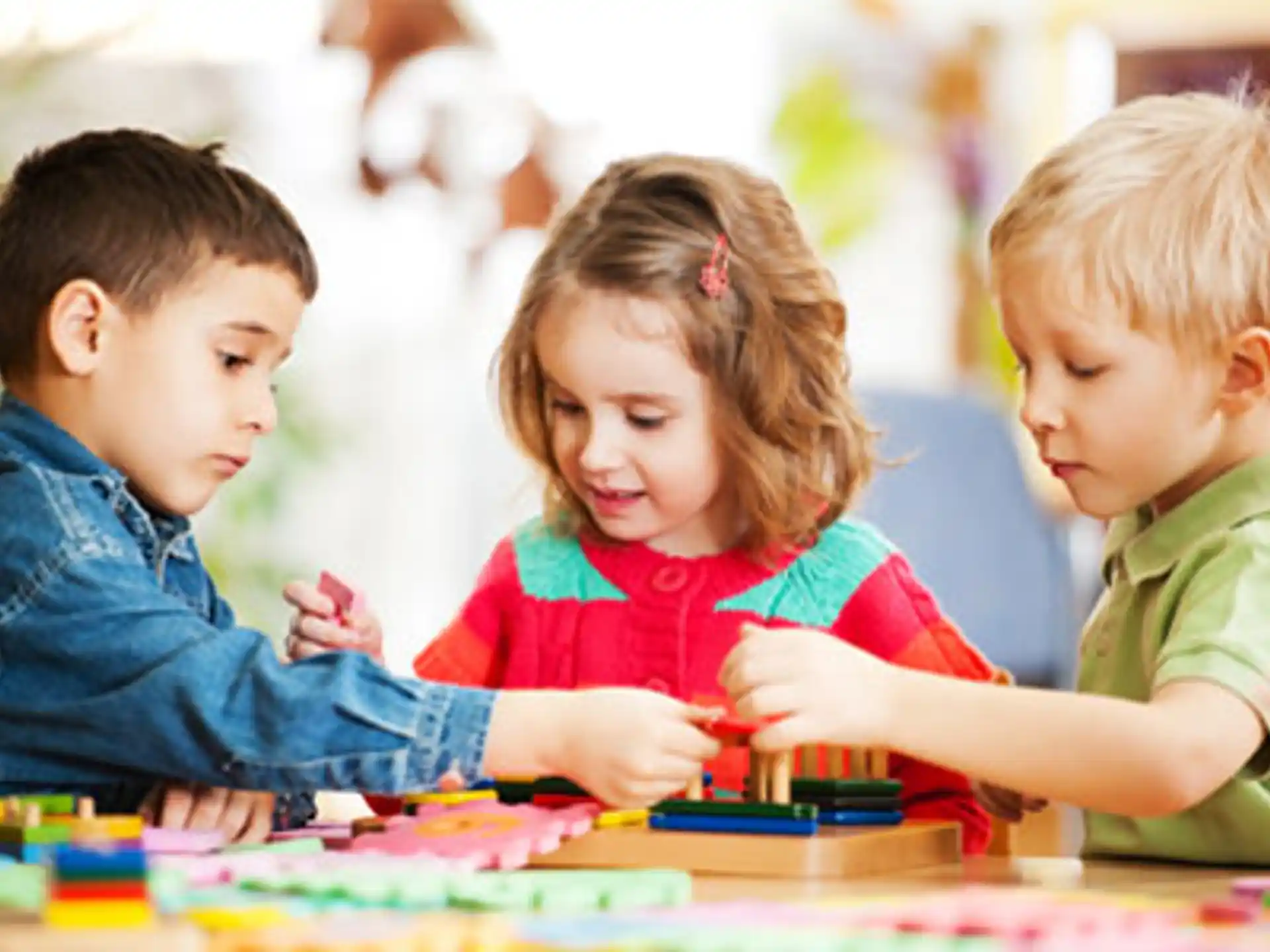 a group of children looking at a book