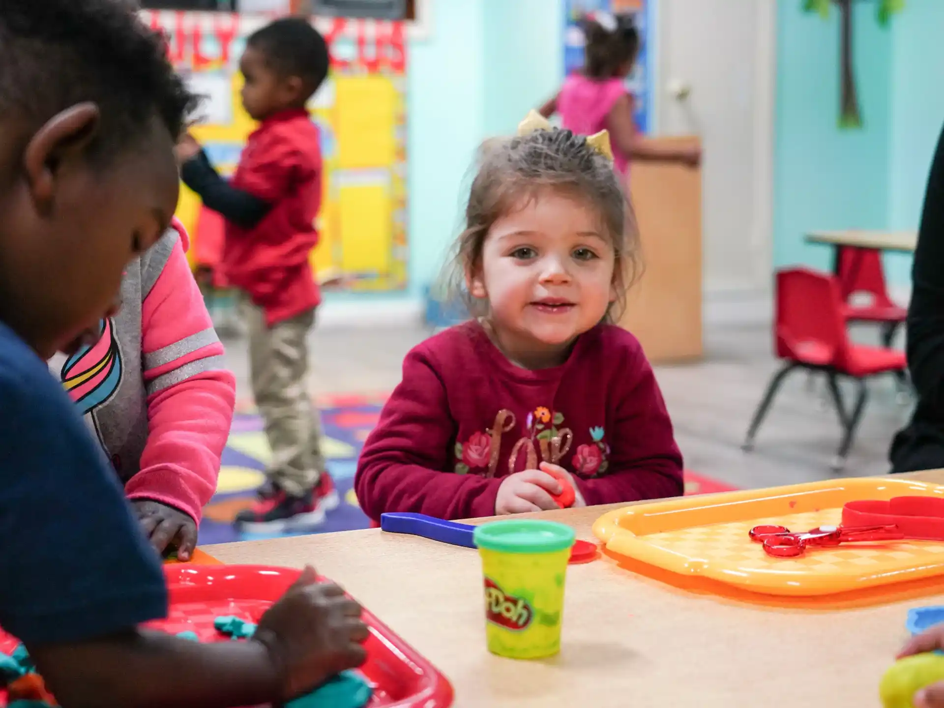 a group of children playing with toys