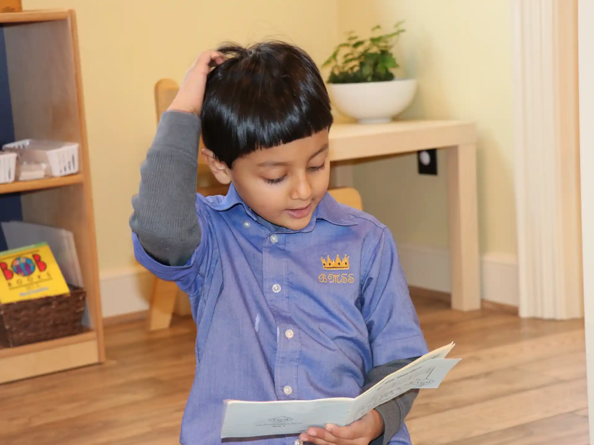 a young boy reading a book