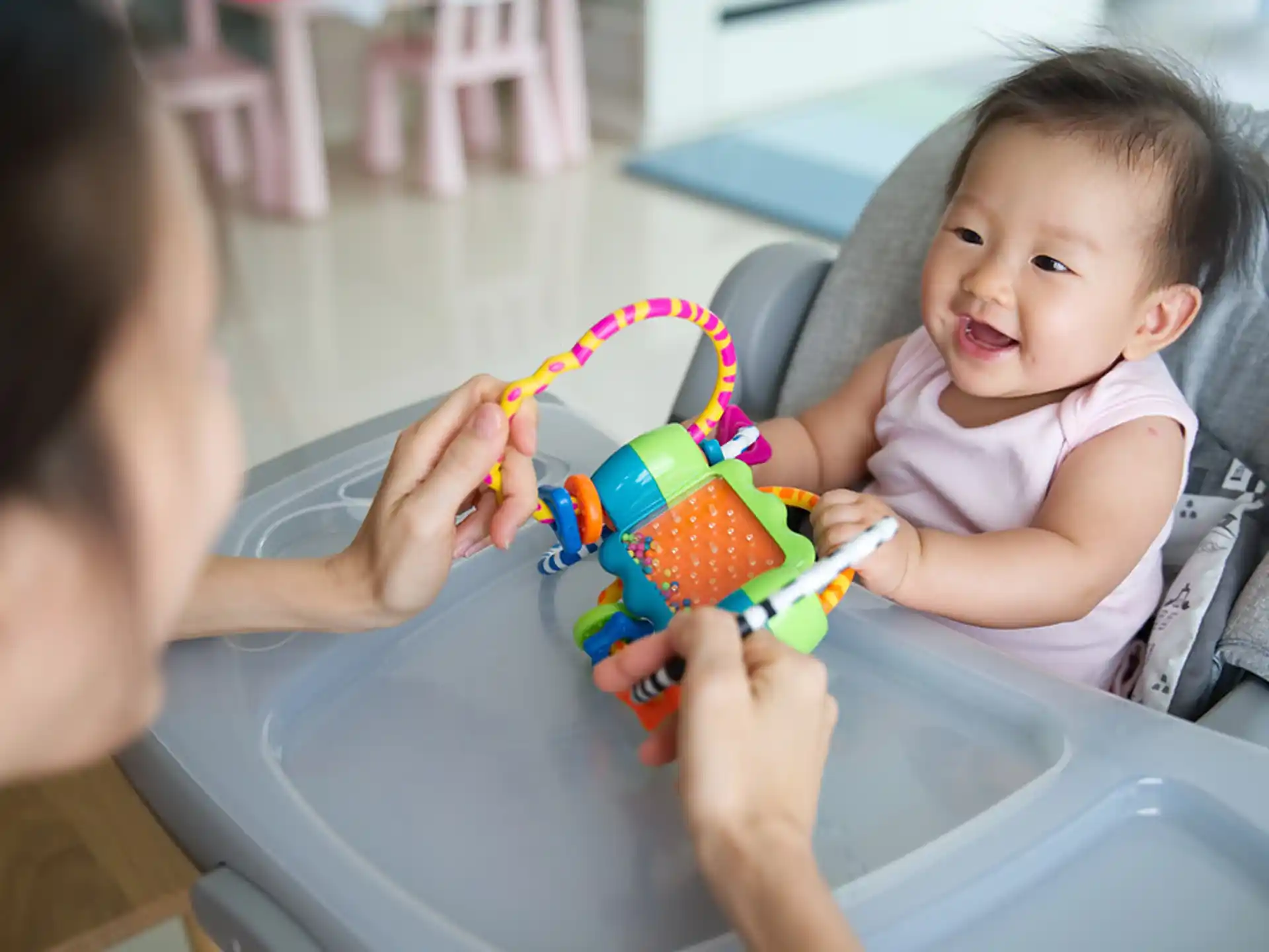 a baby playing with a toy