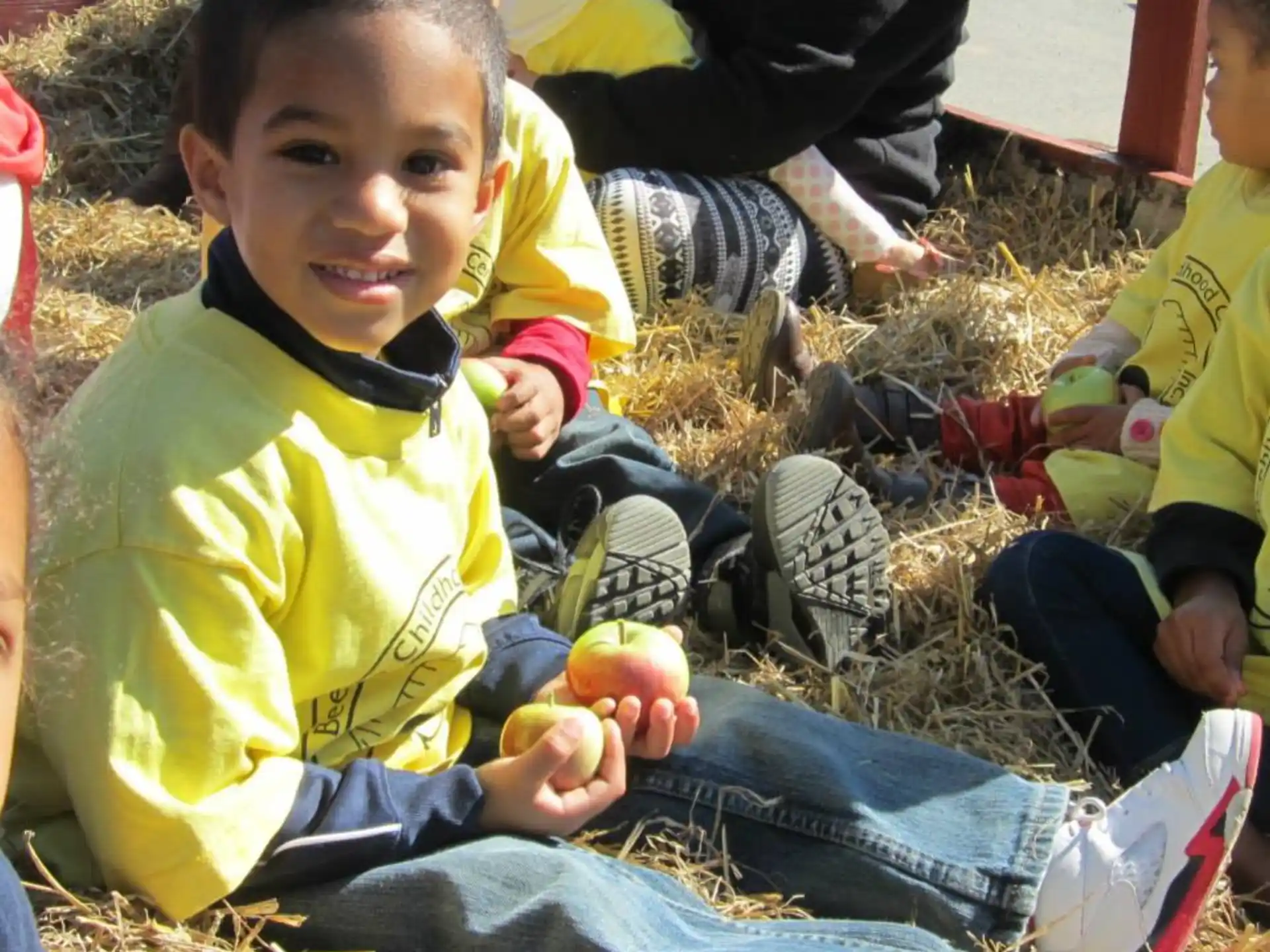 a group of children sitting on the ground
