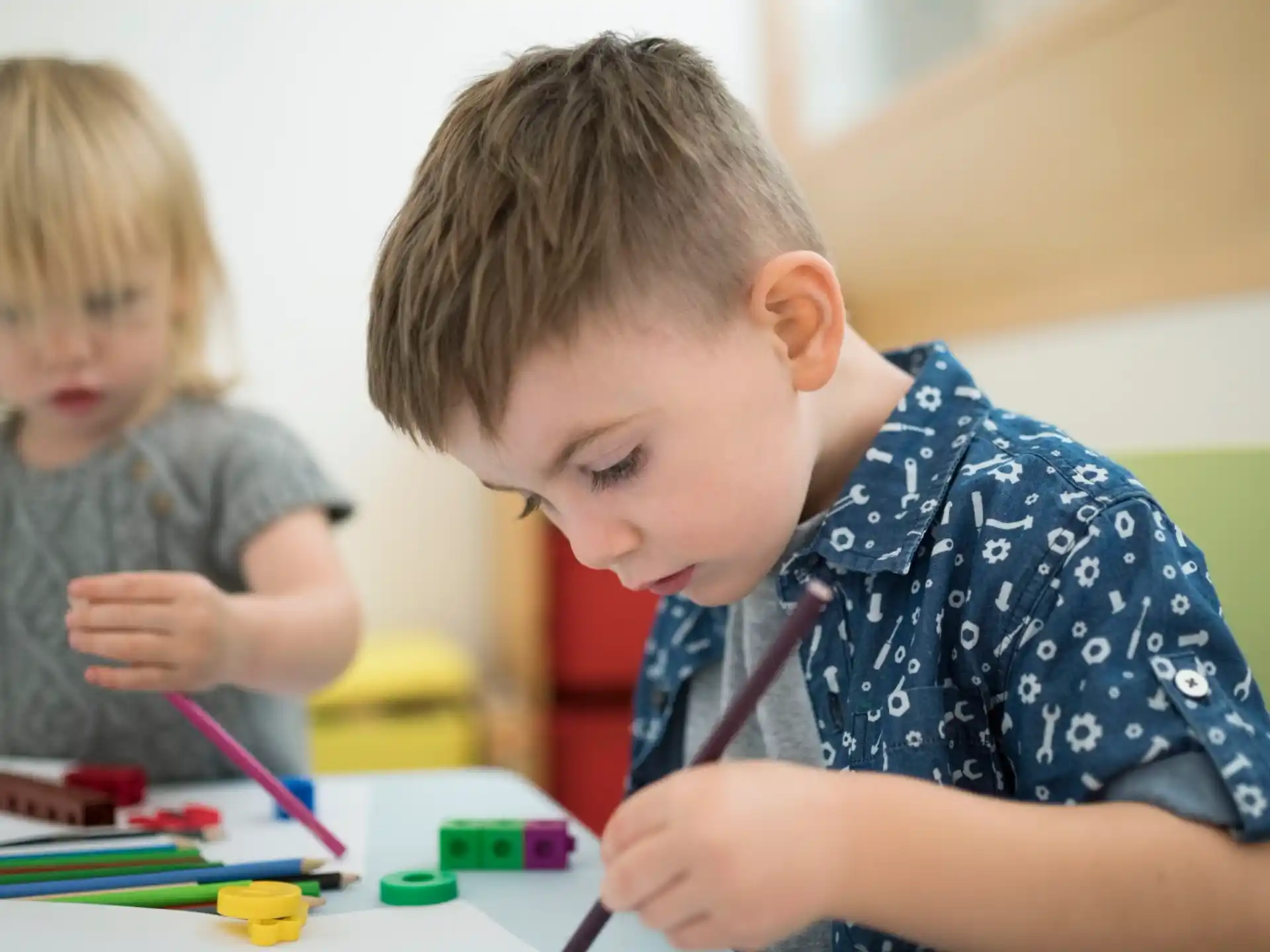 a couple of children playing with toys
