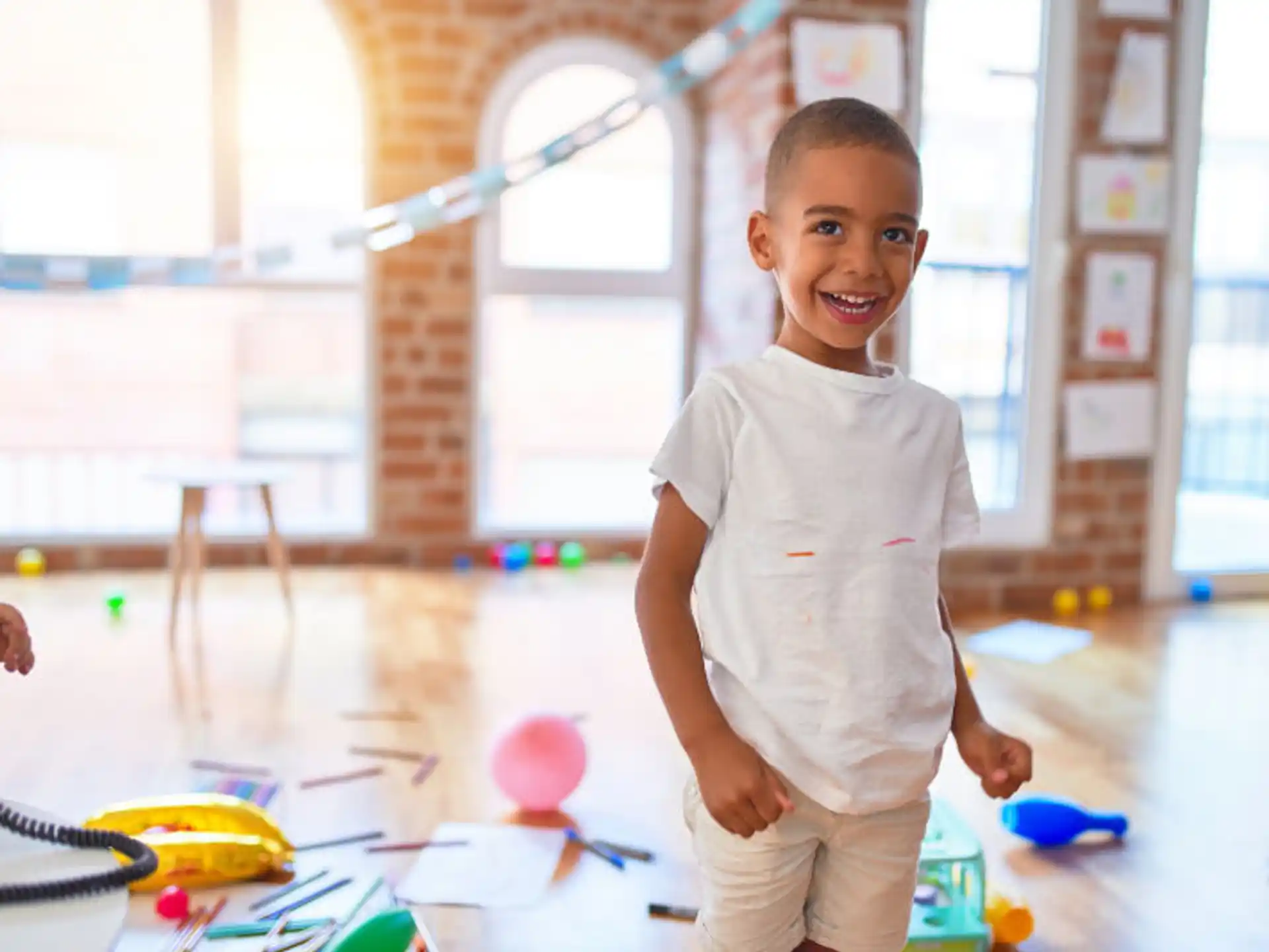 a boy standing in a room