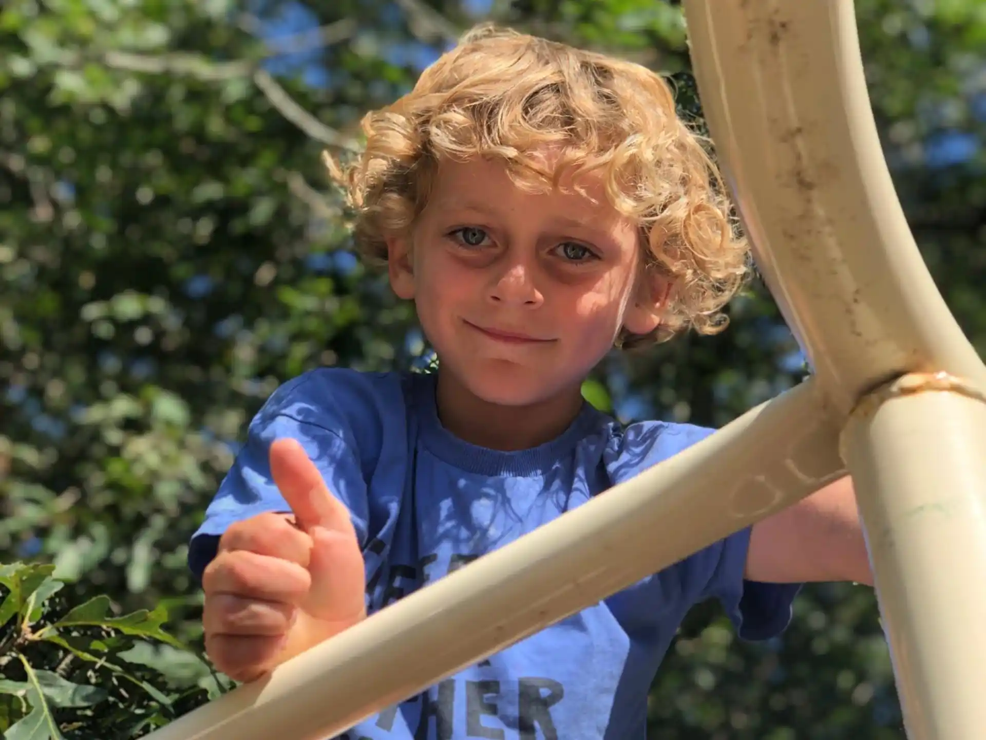 a boy in a blue shirt