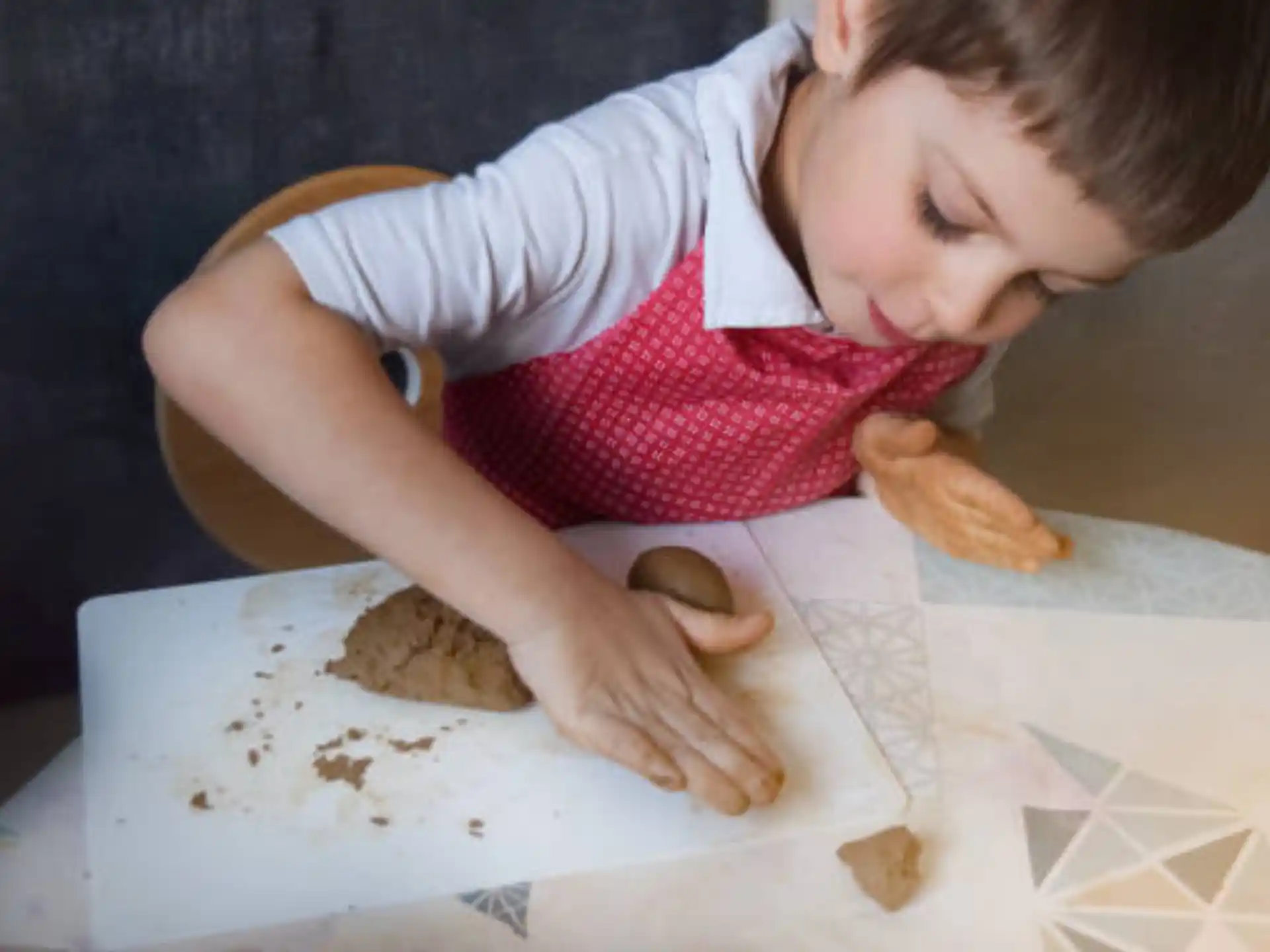 a child looking at a piece of paper