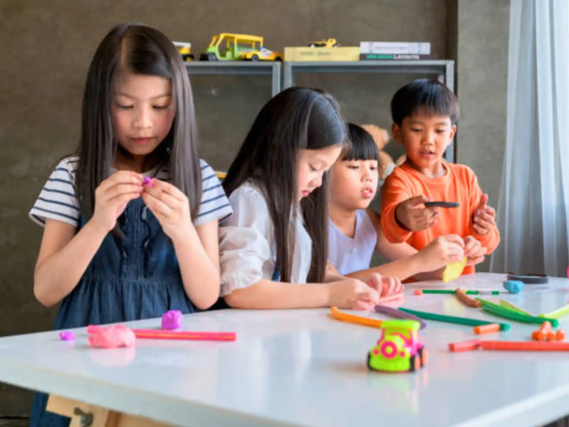 a group of children sitting at a table