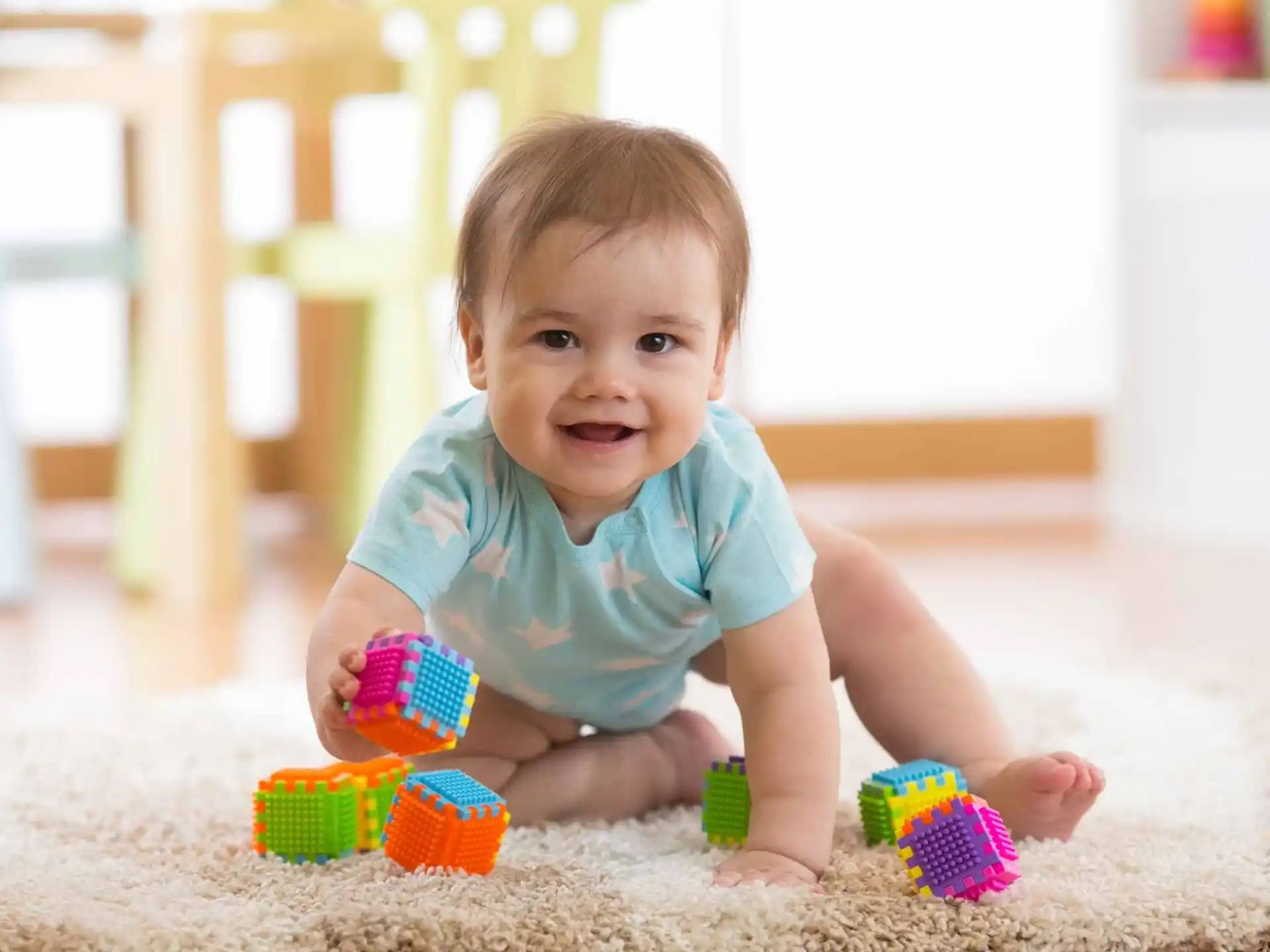 a baby playing with toys