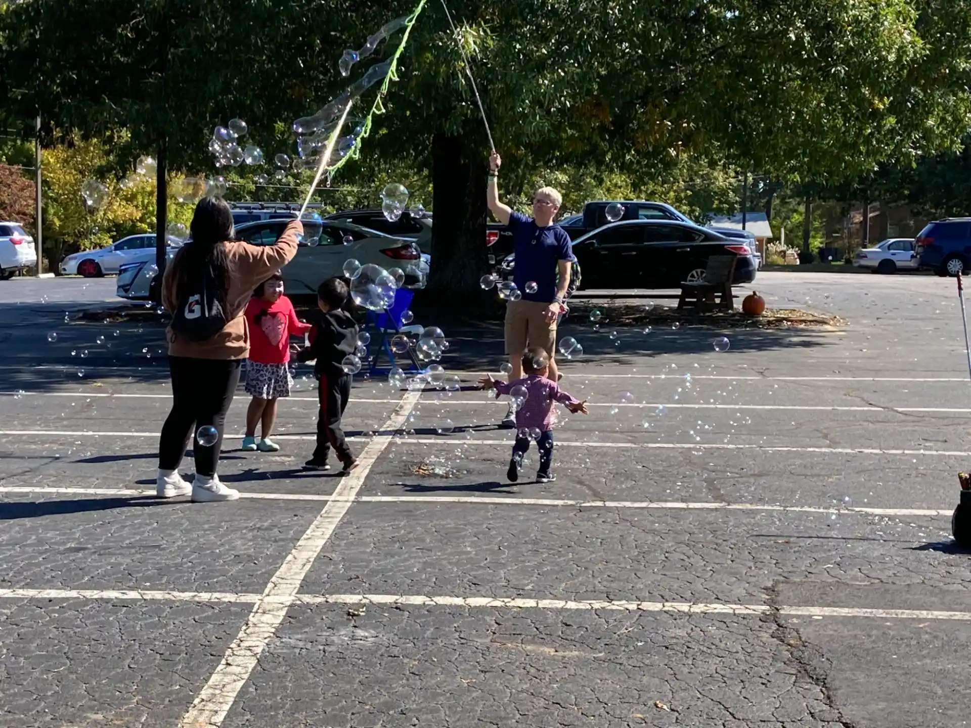 a group of people playing in a parking lot
