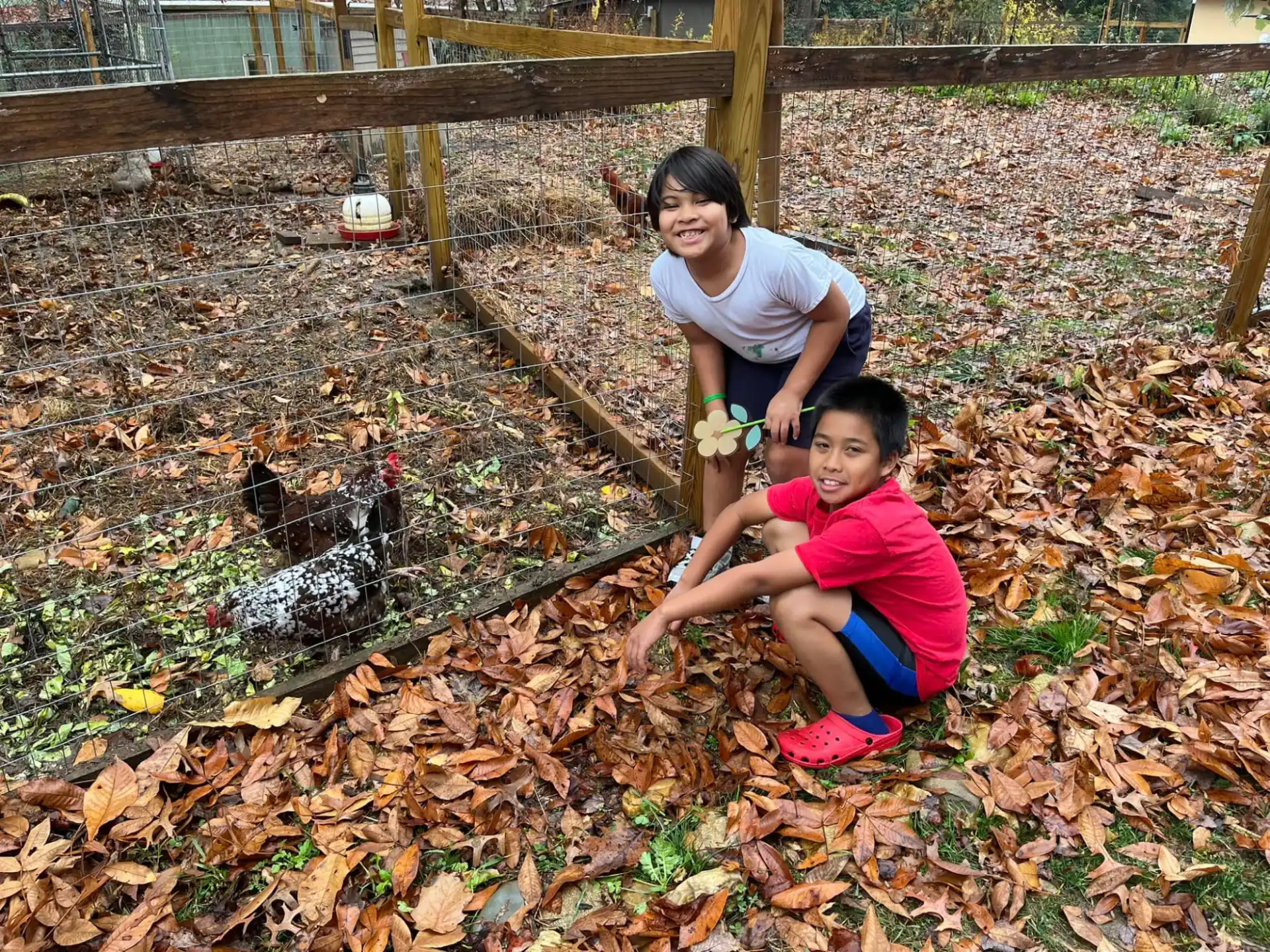 a person and a child in a garden